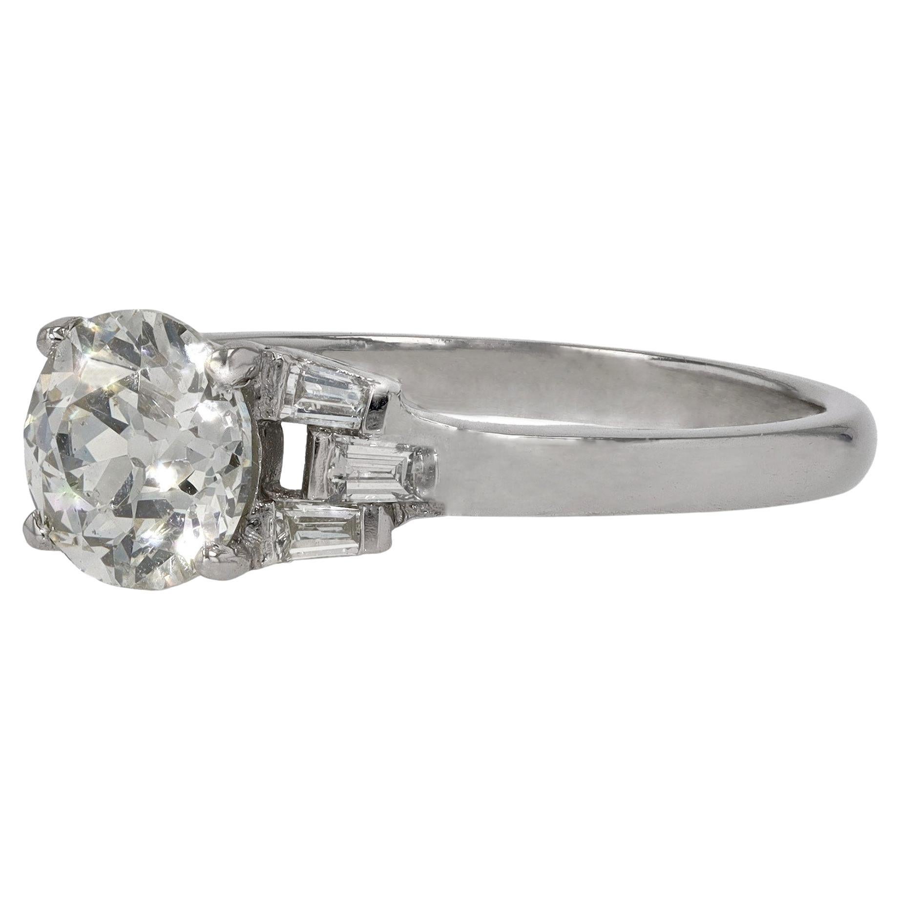 Sleek, geometric lines are portrayed in this classic Art Deco solitaire engagement ring. The near-colorless 1.19 carat old European cut diamond is spectacular and is accompanied by an EGL Gemological Laboratory report. Shimmering in candlelight, the