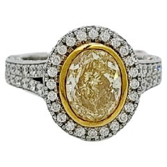 EGL Certified Fancy Yellow Diamond Oval Ring in 18k Two Tone Gold