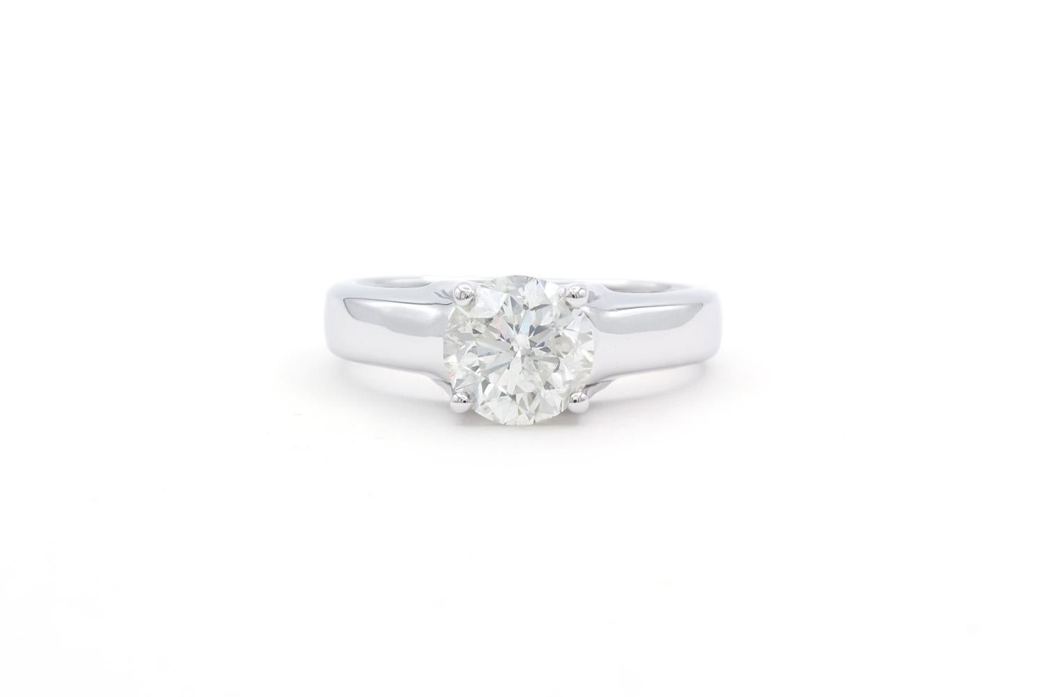 We are  pleased to offer this EGL Certified Hearts & Arrows 14k White Gold & Natural Diamond Solitaire Engagement Ring. This stunning ring features an EGL USA certified ideal cut hearts and arrows 1.55ct H/I1 round brilliant cut diamond set in a