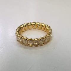 EGL Certified Light Fancy Yellow Oval Cut Bezel Set Eternity Diamond Ring