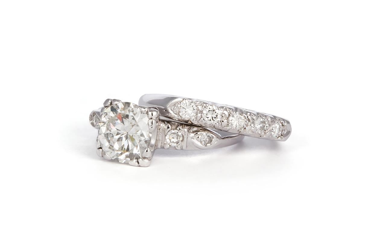 We are pleased to offer this EGL Certified Platinum & Diamond Antique Engagement Ring Set. This beautiful wedding set features an an engagement ring set with an EGL certified 1.39ct H/SI3 round brilliant brilliant cut diamond center stone accented