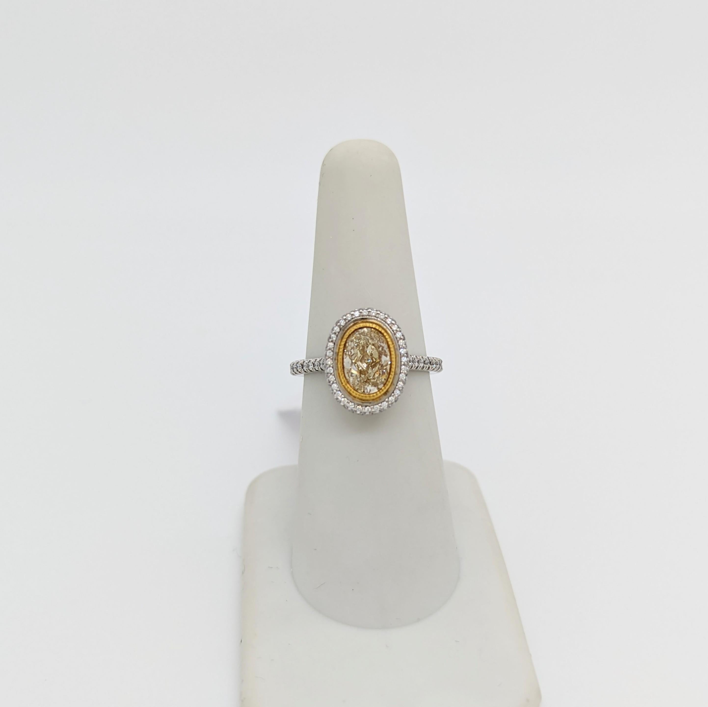 EGL Fancy Yellow Oval and White Diamond Ring in 18K 2 Tone Gold In New Condition For Sale In Los Angeles, CA