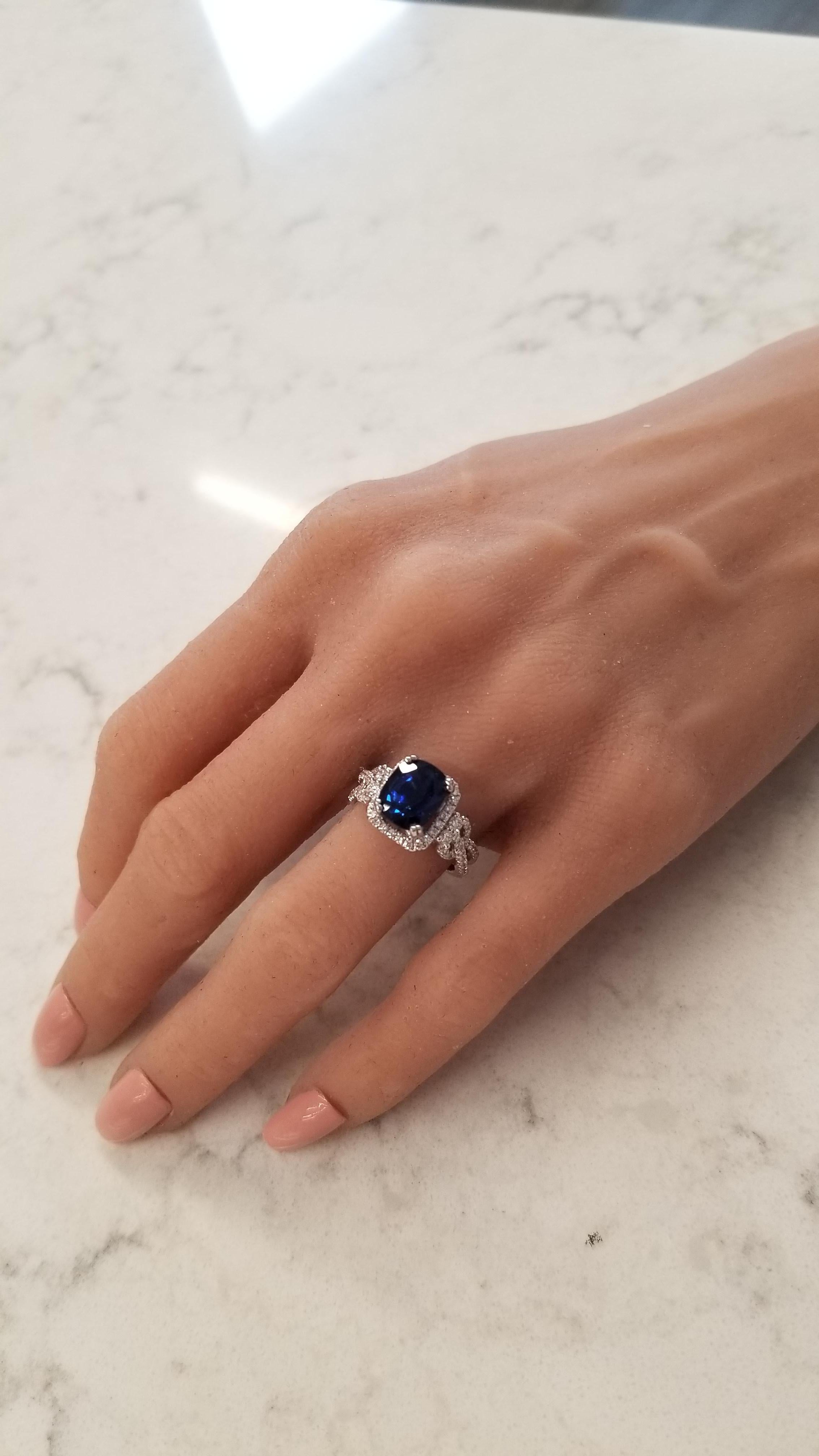 This is a 3.86 carat cushion cut blue sapphire that measures 9.56x7.82mm. The gem source is Sri Lanka; its color is royal blue and it is evenly distributed throughout the gem. Its luster and transparency is superb. Sparkling round brilliant cut