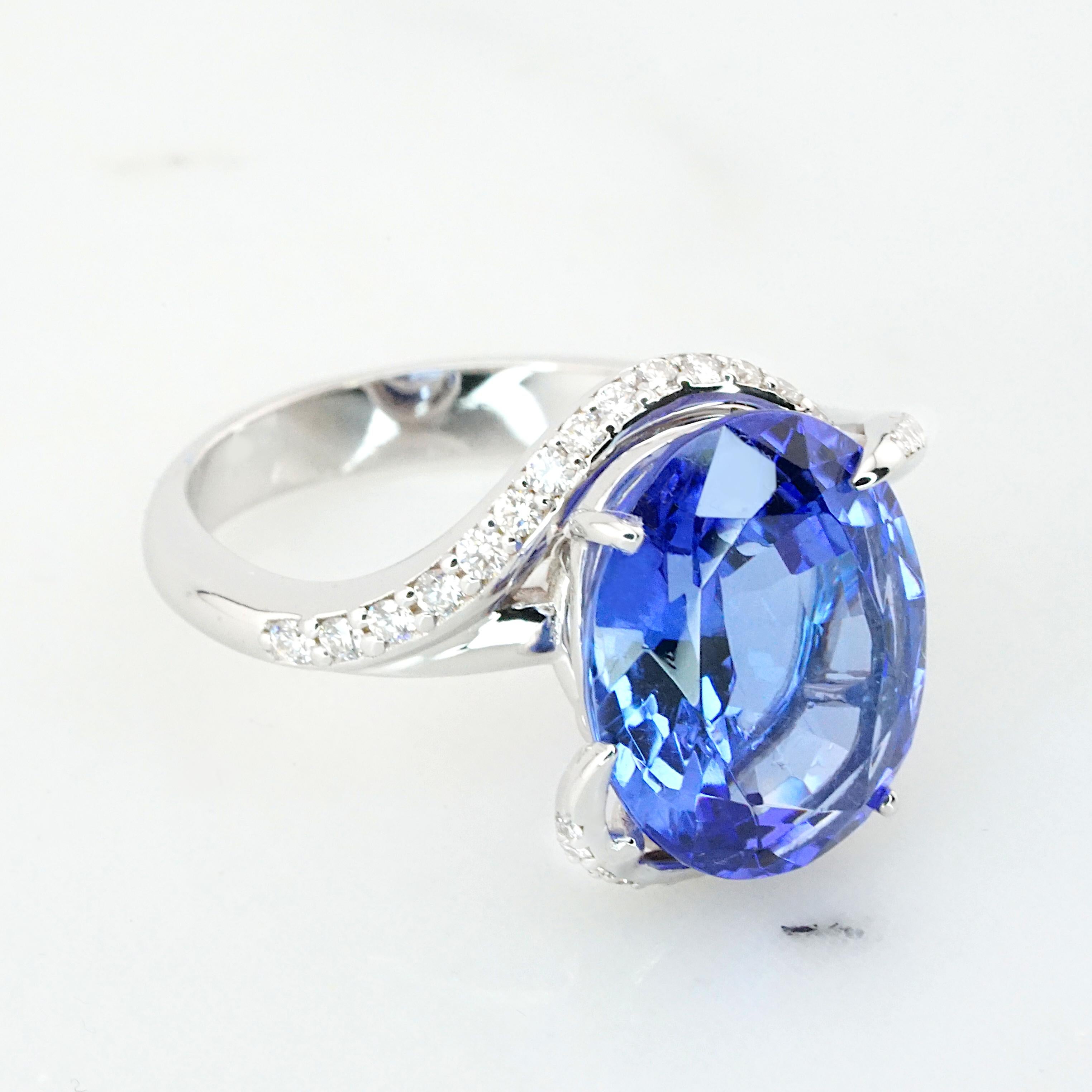 Presenting an extraordinary 7-carat Blue Violet Tanzanite, vivid in color and certified by EGL South Africa, set in an exquisite 18K white gold ring. The captivating design features a beautiful spiral that accentuates the Tanzanite's allure. The