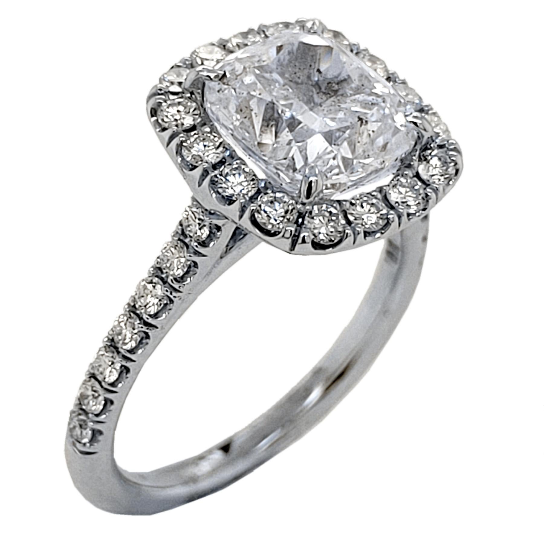 A very shiny 3.01 Ct Cushion E/SI3 EGL US certified center Diamond set in a fine 18k gold Pave set Engagement Ring with a halo. Total diamond weight of 0.58 Ct. on the side. 

Diamond specs:
Center stone: 3.01 Ct EGL US Certified E/SI3 Cushion