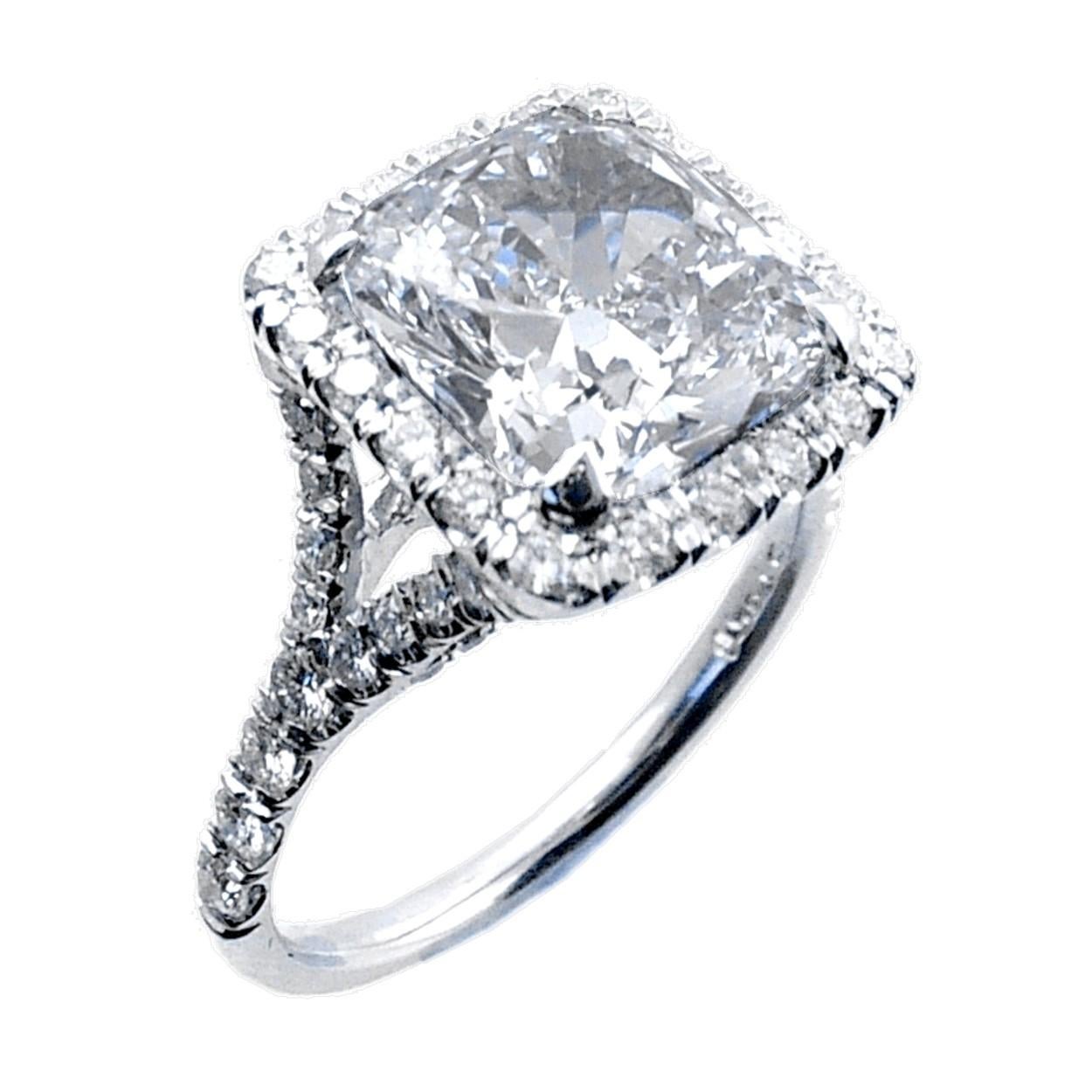 A very shiny 4.06 Ct Square Cushion K/SI1 EGL US certified center Diamond set in a fine Split Shank Platinum Pave set Engagement Ring with a halo. Total diamond weight of 0.59 Ct. on the side. 

Diamond specs:
Center stone: 4.06 Ct EGL US Certified