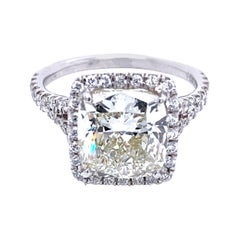 EGL US 4.06 Carat K/SI1 Cushion Platinum Pave Set Diamond Ring with Halo
