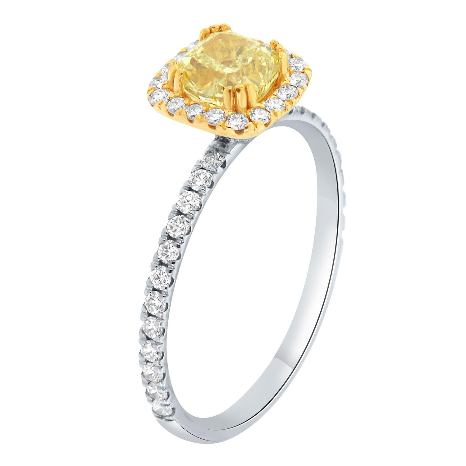 This Delicate ring is spectacular! It features a 0.83-carat cushion-shaped Yellow diamond-set in twelve (12) minimalist prongs and encircled by brilliant round diamonds Micro-Prong set to maximize brilliance. The Cushion-Shap Halo crown towered on