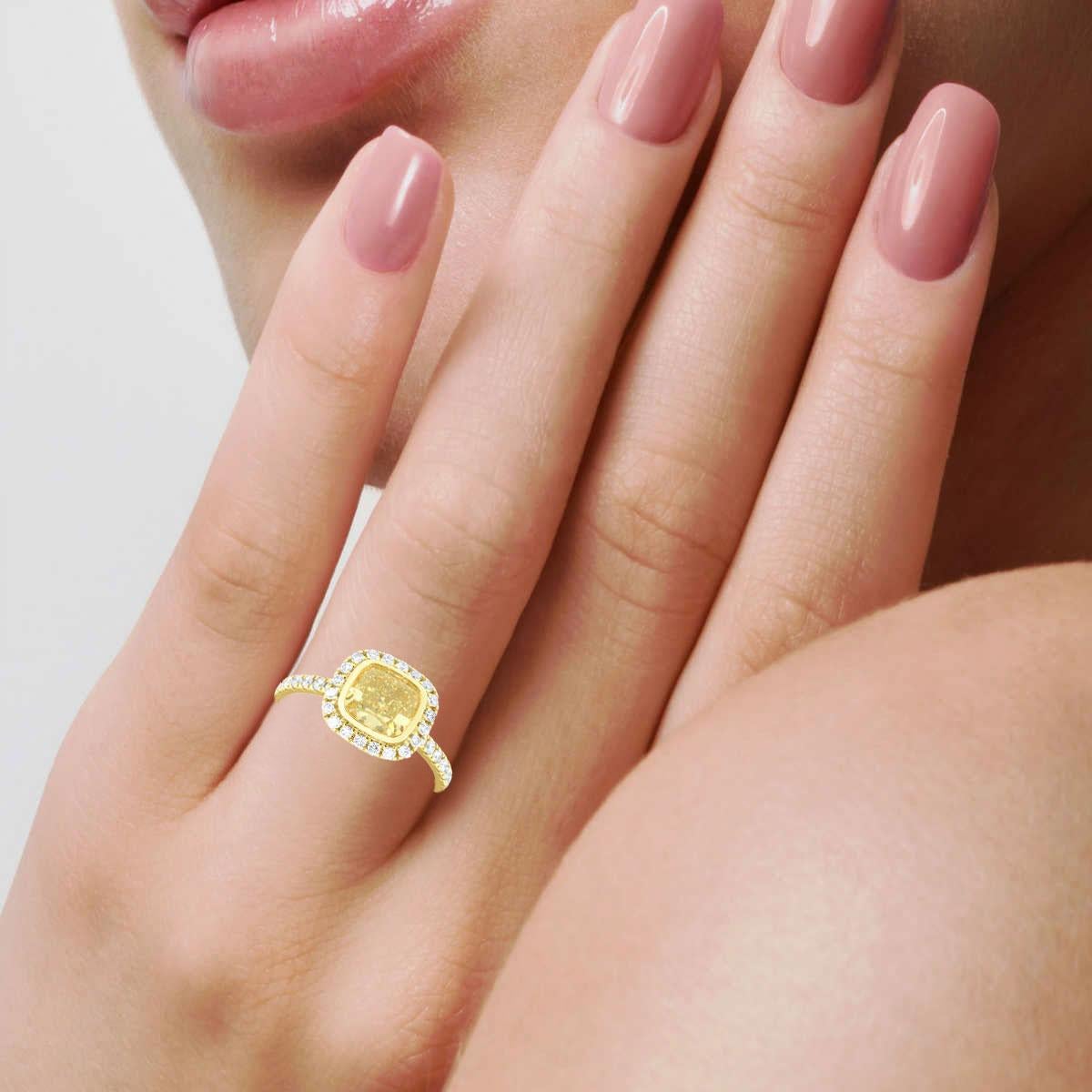 Women's EGL USA 1.52 Carat Elongated Cushion Yellow Diamond Halo 18K Yellow Gold Ring For Sale