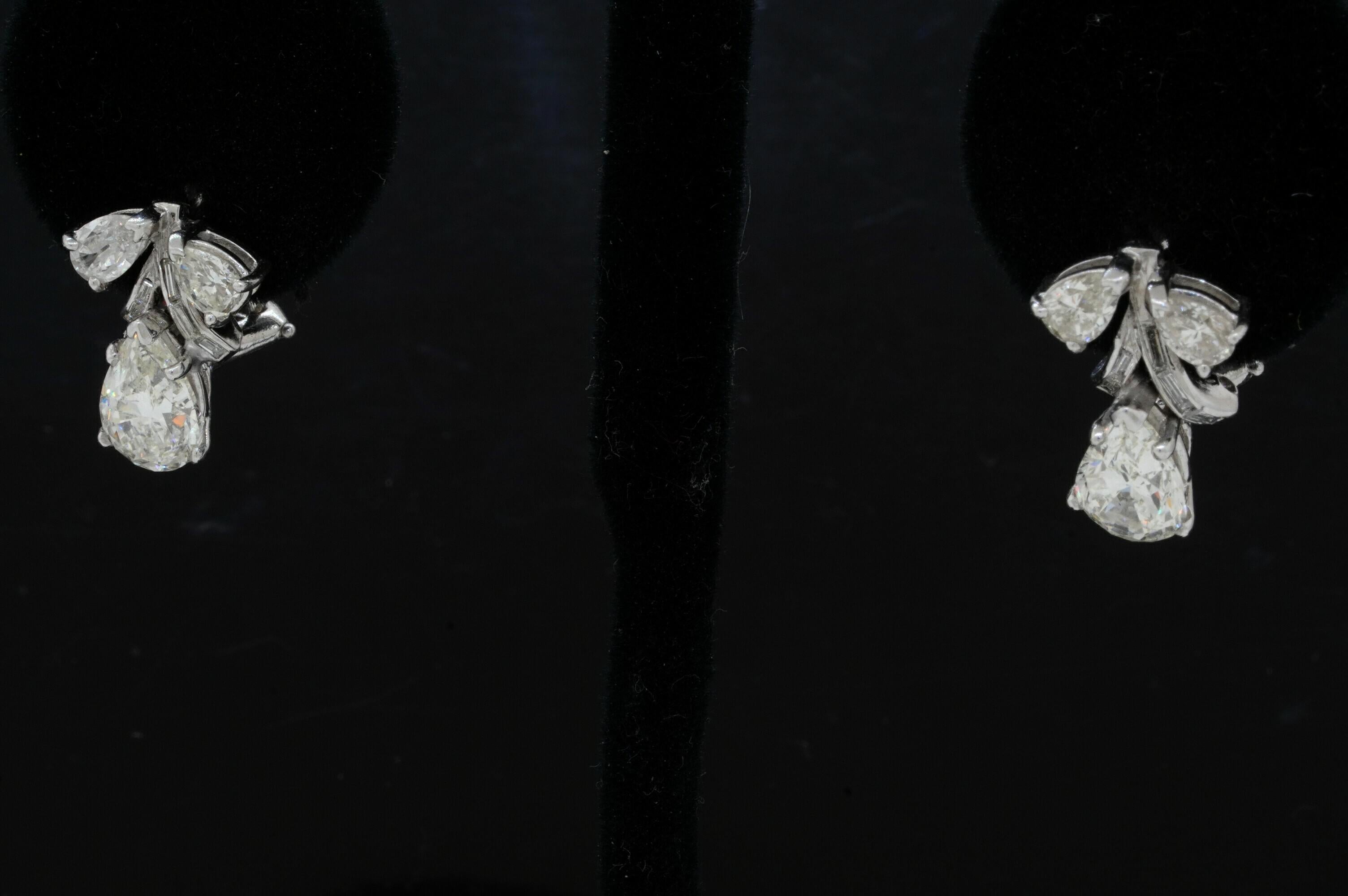 EGL USA 1950s Platinum 4.54CT VS-SI Pear Diamond Earrings w/ Approx. 1.5CT Ctrs. In Excellent Condition For Sale In Fort Lauderdale, FL