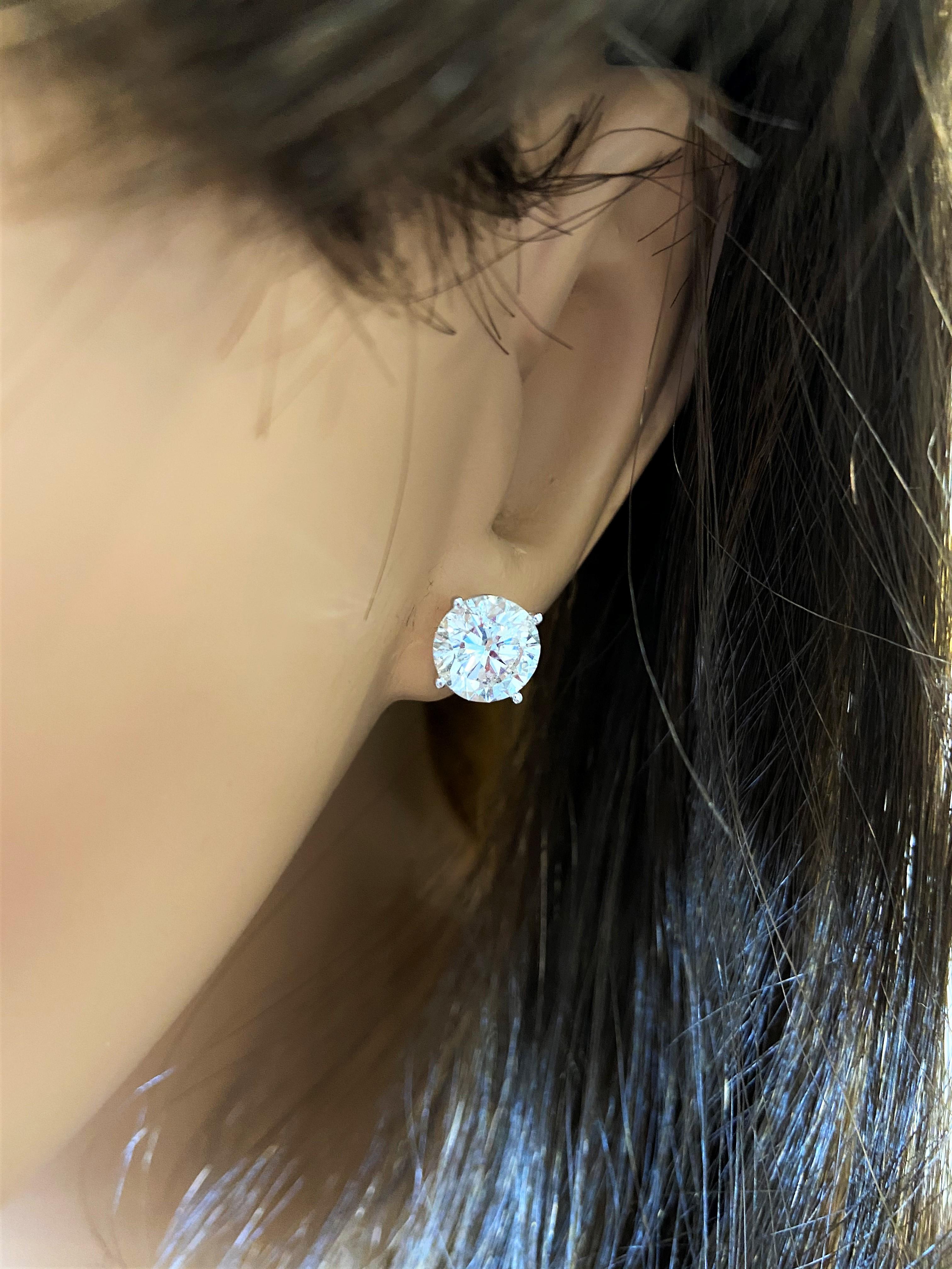 Stunning 14 Karat white gold EGL USA certified handmade earrings featuring 2 round brilliant cut diamonds weighing 4.00cts total G-H color SI2-SI3 clarity. The stunning earrings measure 8.00mm in diameter, these gorgeous earrings are classic and