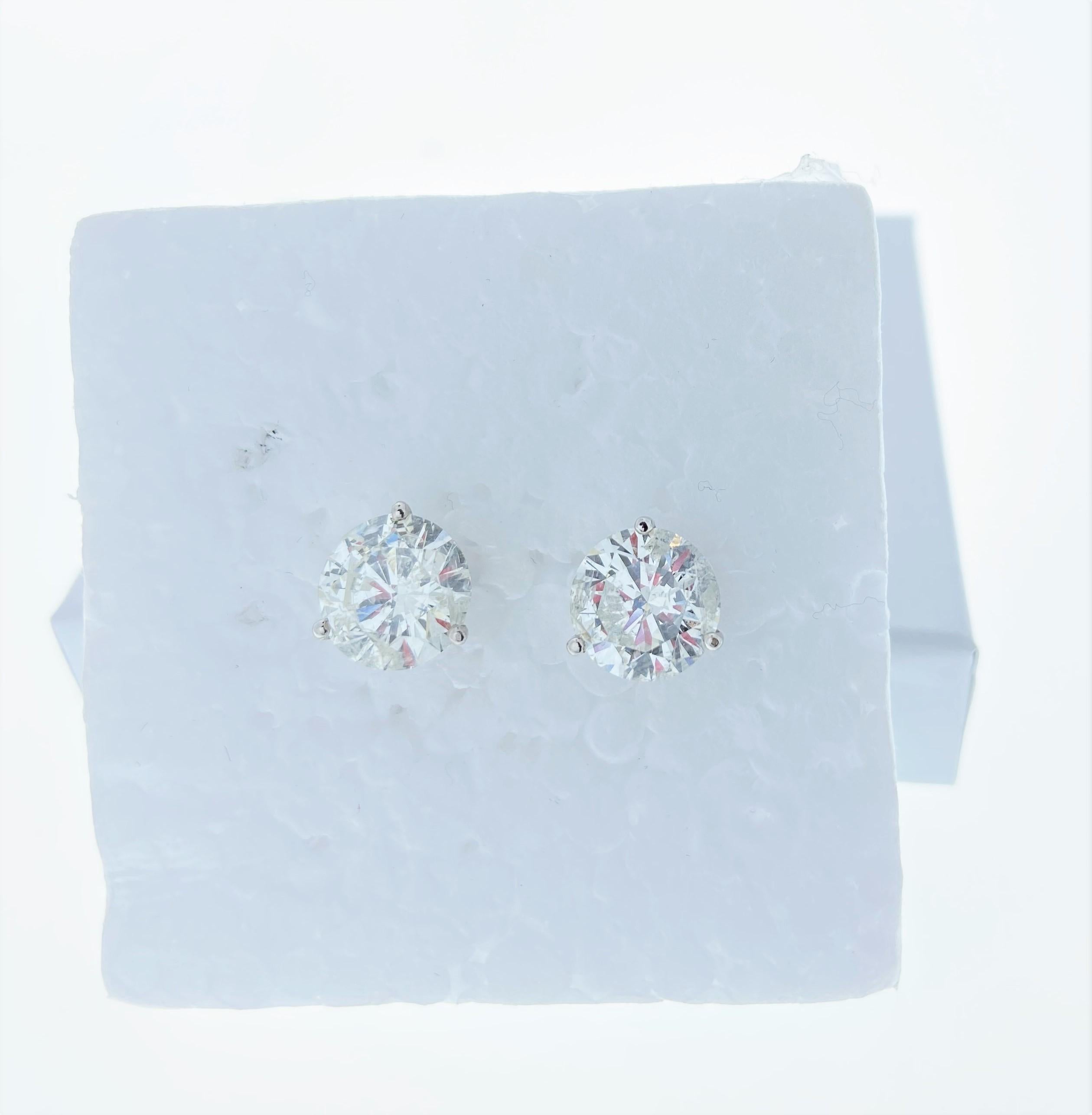 Stunning 14 Karat White Gold EGL USA certified handmade earrings featuring 2 round brilliant cut diamonds weighing 5.10 cts total H-I color I1 clarity. The stunning earrings measure 8.75 mm in diameter, these gorgeous earrings are classic and