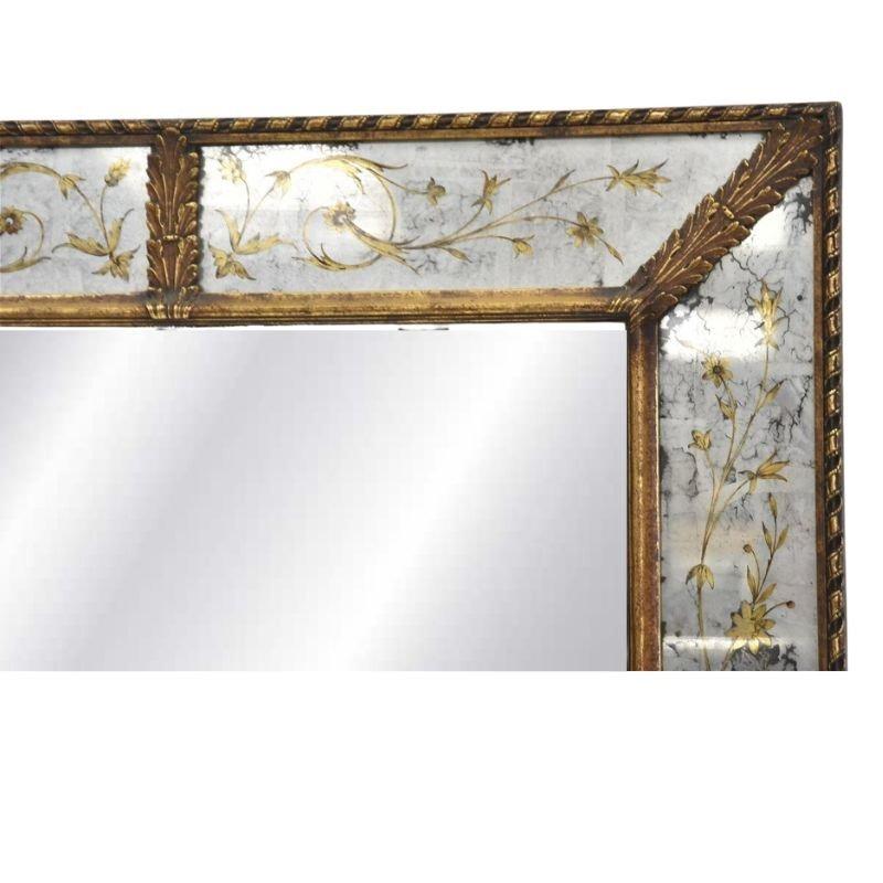Elegance and sophistication meet in this stunning eglomise gilt painted, shadow box mirror. This exquisite mirror combines the timeless allure of eglomise glass with intricate gilt-painted floral motifs.  As you gaze upon this exceptional piece,