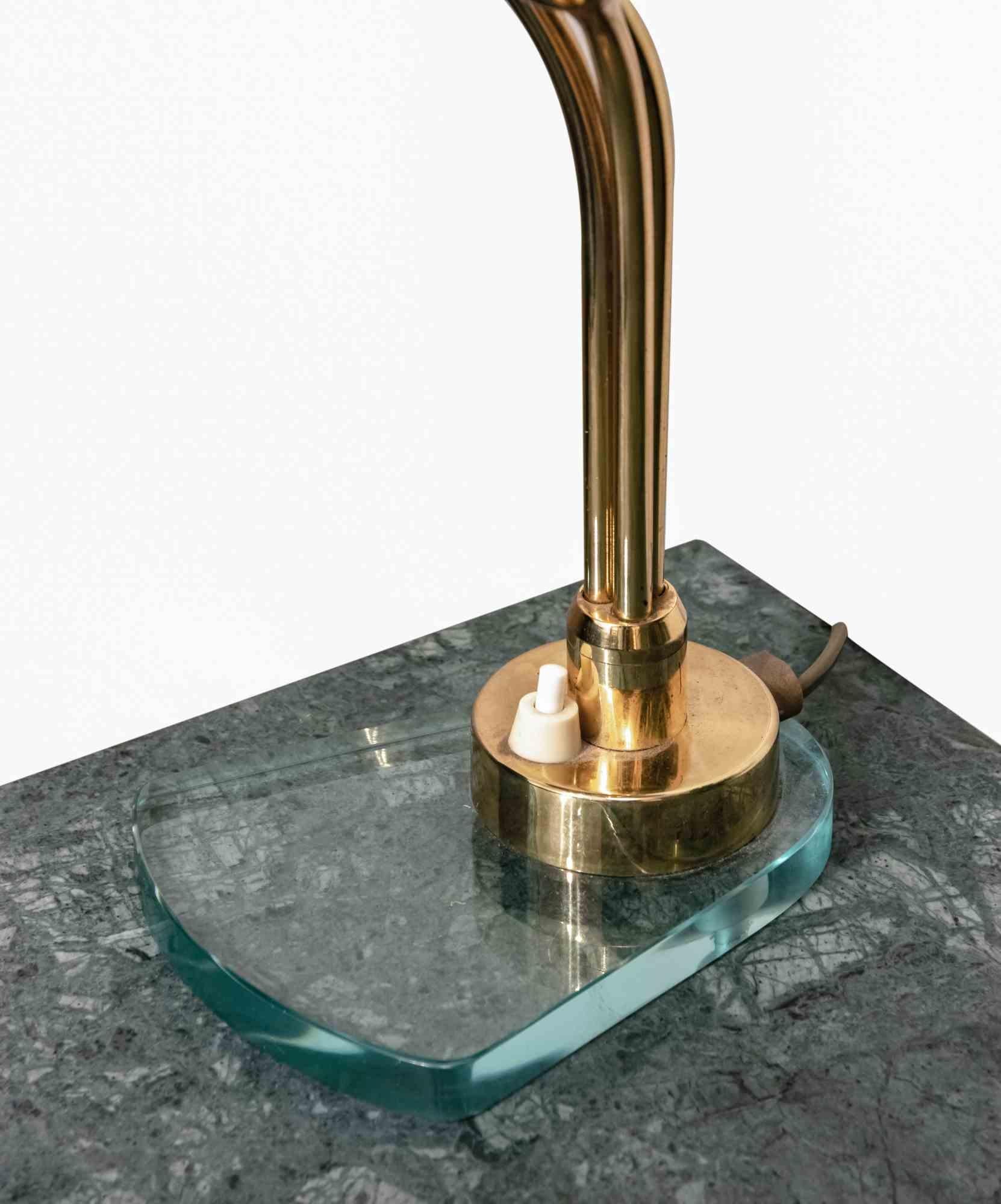 Ego Luce table lamp is an original design furniture realized in the 1970s and attributed to the Italian Designer Giuseppe Ostuni. 

A beautiful vintage table lamp.

Brass and Glass Base. 

Made in Italy.

Total dimensions: 30 x 23 x 23 cm.