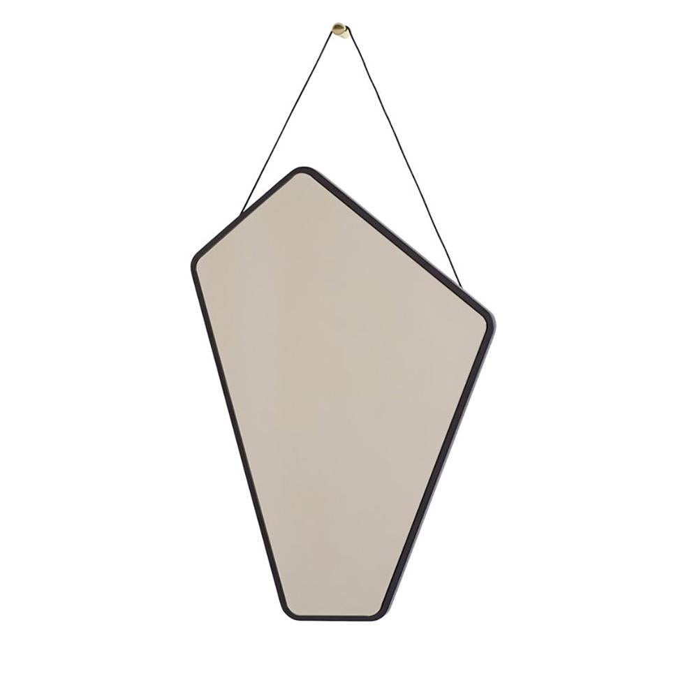 The Ego mirror has a perfect asymmetry that makes it possible to place it in many different positions. The mirror comes with a brass hook and a leather strap for hanging. The frame is black stained oak and the mirror is bronzed. The frame is made in