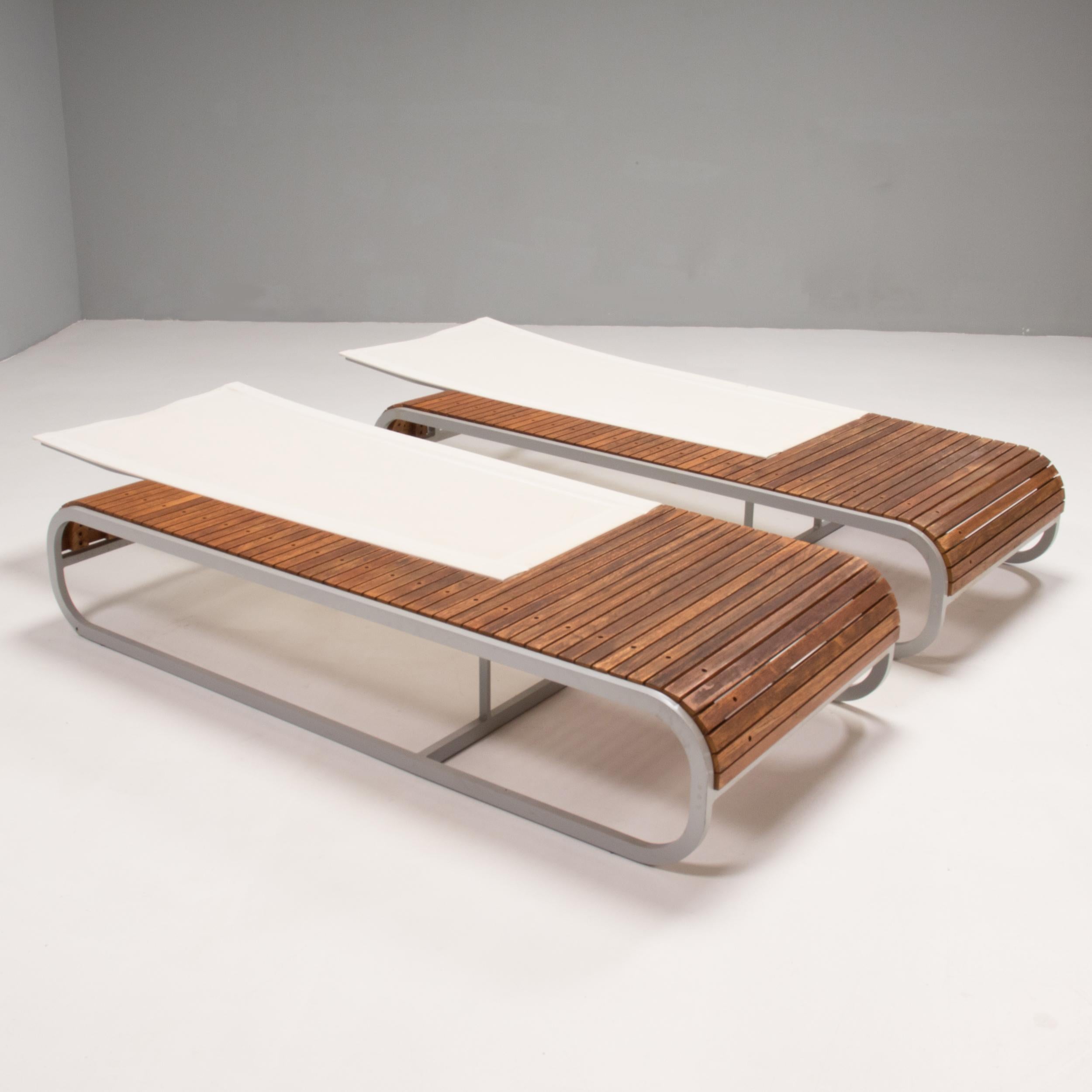 Designed by Thomas Sauvage for EGO Paris, the Tandem sun lounger was awarded the Red Dot design award in 2008.

Constructed from a thermo-lacquered aluminum frame, the sun lounger features a wooden deck surround, with a white mesh backrest which