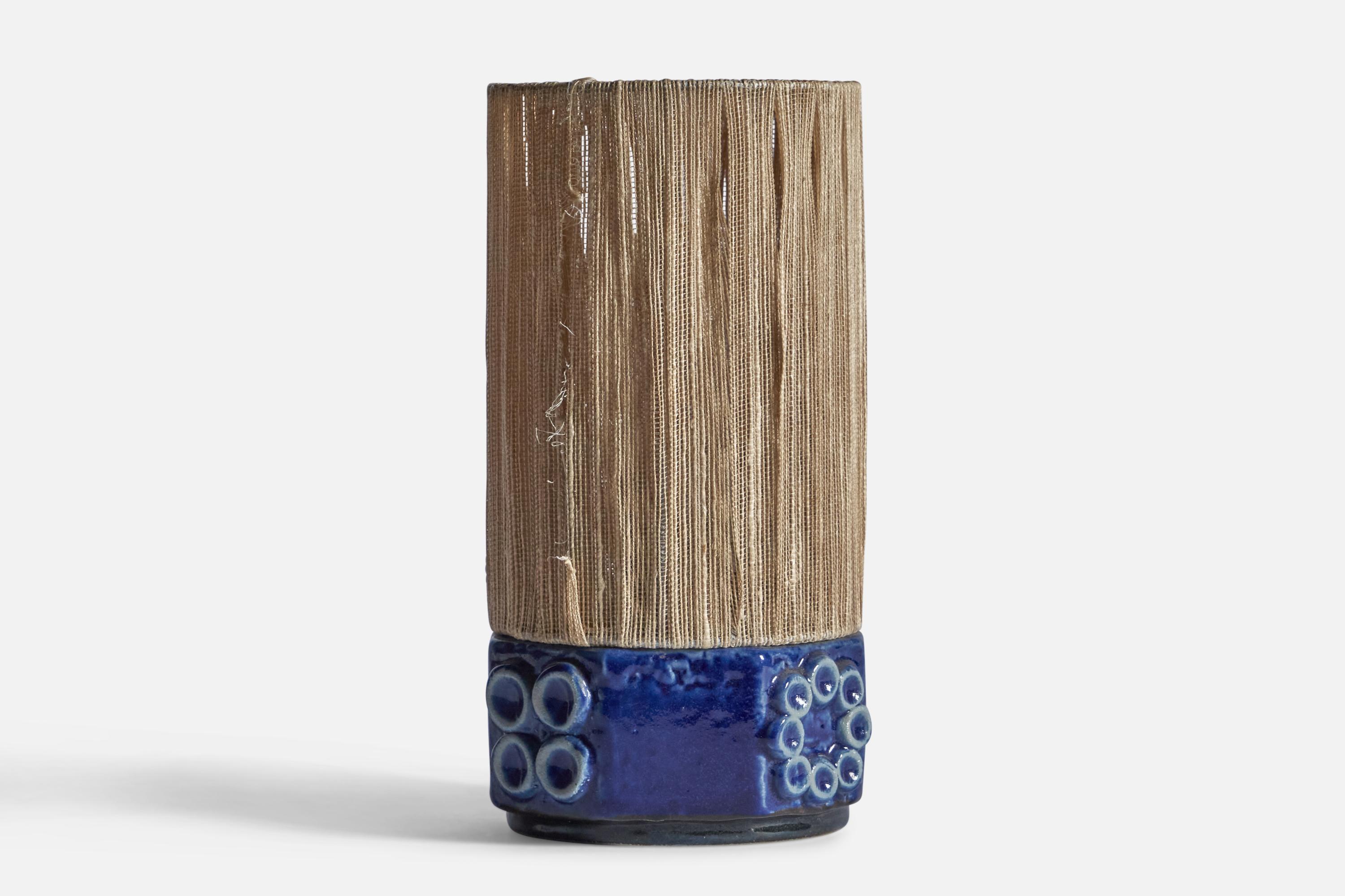 A blue-glazed stoneware and fabric cord table lamp, designed and produced by Ego Stengods, Sweden, 1970s.