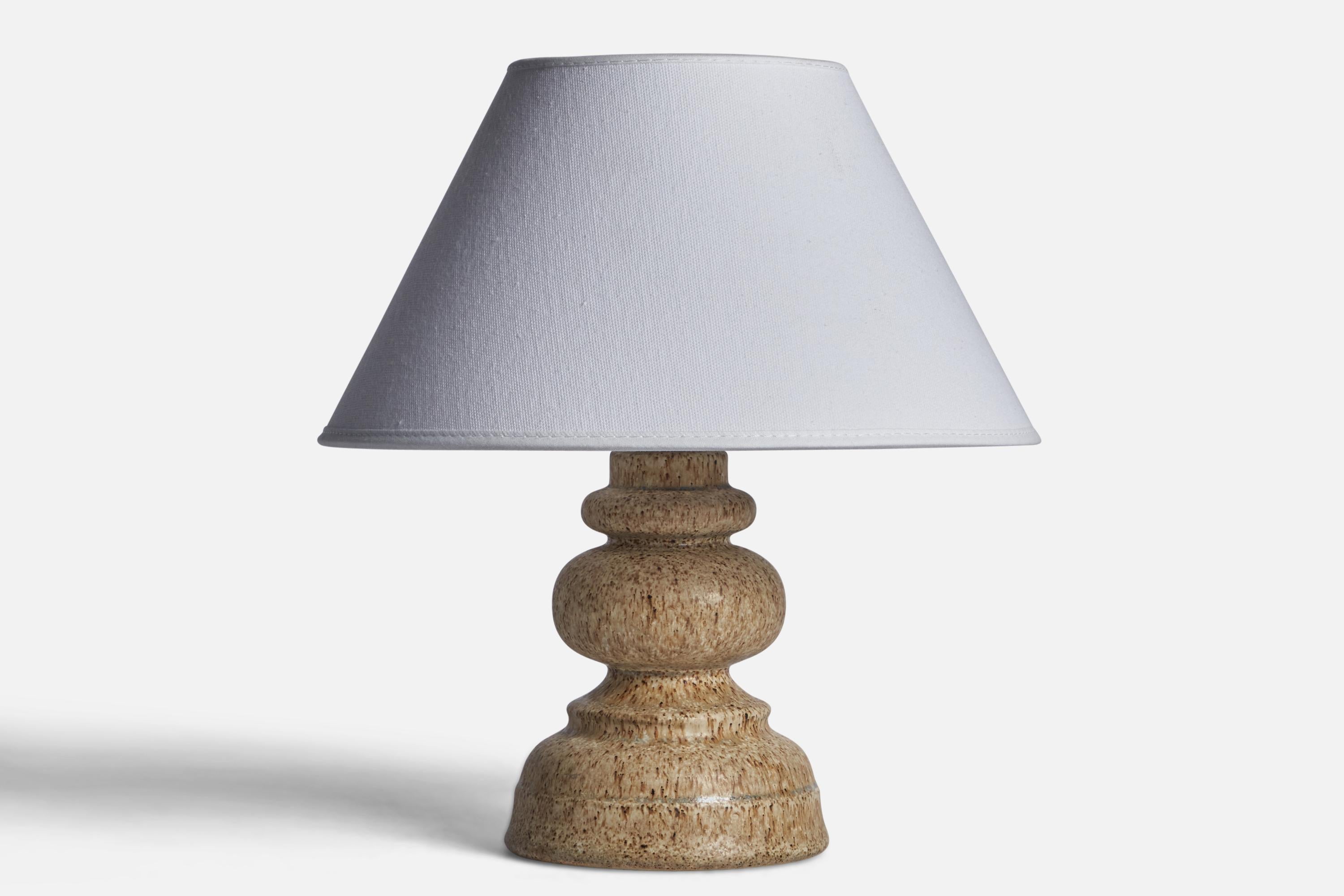 A grey-glazed stoneware table lamp produced by Ego Stengods, Sweden, c. 1960s.

Dimensions of Lamp (inches): 7.75” H x 4.55” Diameter
Dimensions of Shade (inches): 7” Top Diameter x 10” Bottom Diameter x 5.5” H 
Dimensions of Lamp with Shade