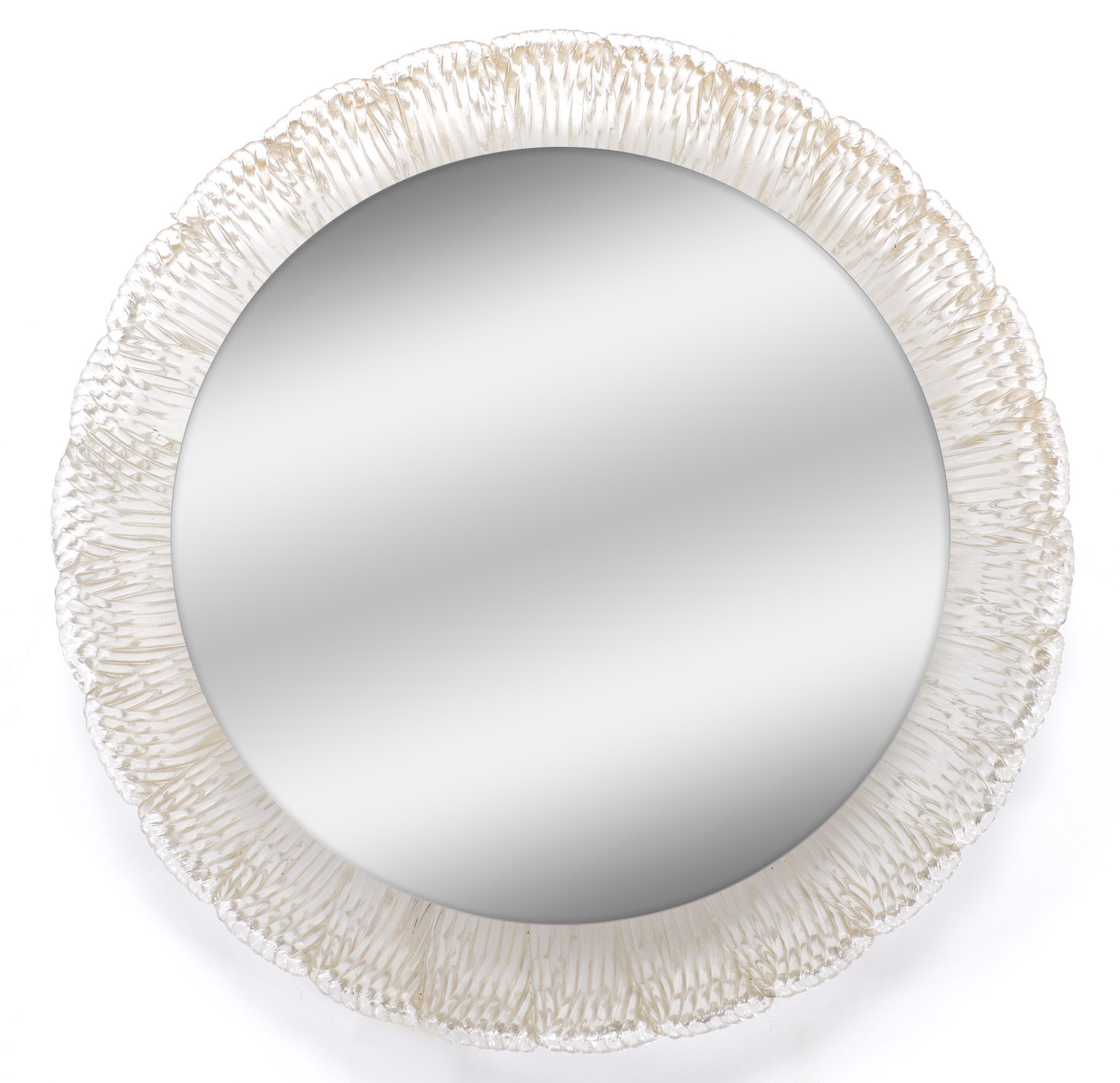 A round backlit mirror mounted on a pleated lucite shell by the renowned German lamp manufacturer, Egon Hillebrand
The design of this mirror was created in 1968. Nice classy mirror. Great looking piece.
