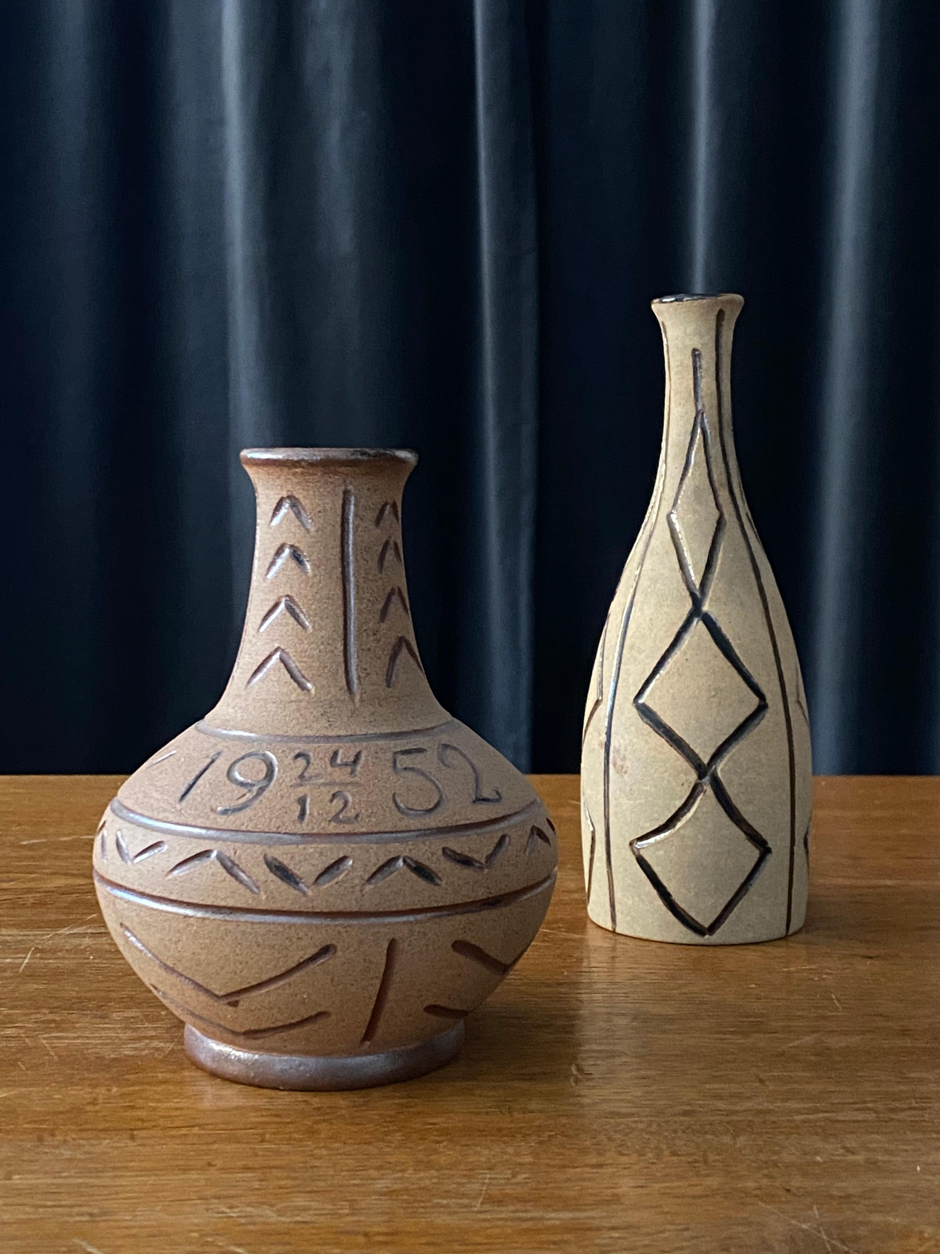 Two stoneware vases by Egon Larsson features hand painted relief-ornamentation. 

The taller vase is made for and dedicated to a friend 