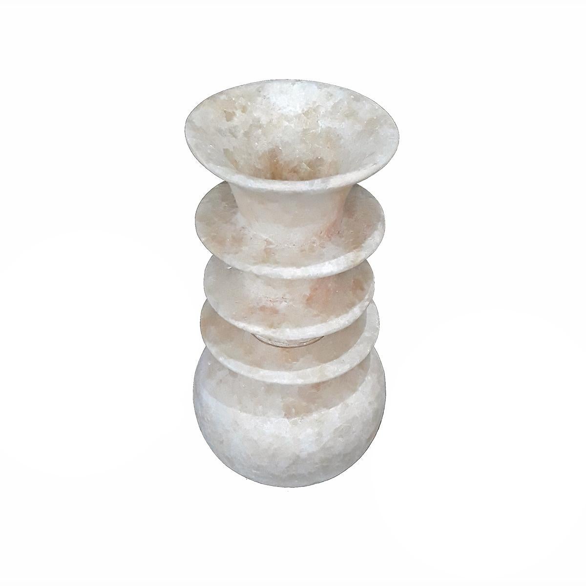 An alabaster vase, hand-crafted in Luxor, Egypt. Two pieces, with a bottom opening at the base. It allows the piece to be used as a lamp or screen for low-intensity lights (professional conversion recommended). 

The vase can be shipped in two