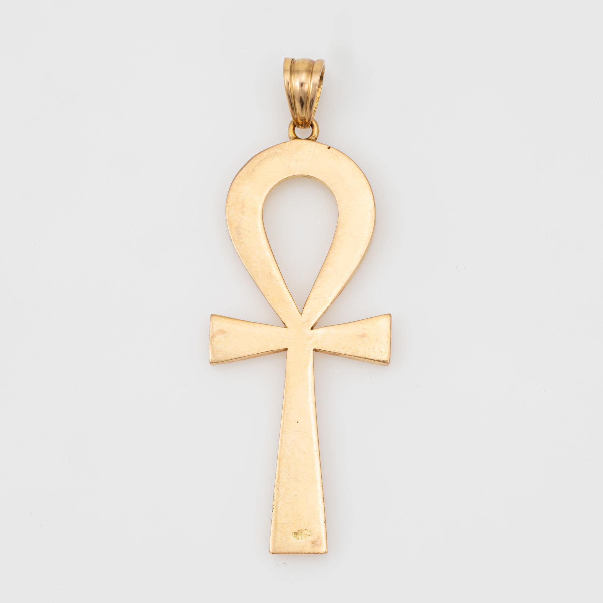 Stylish Egyptian Ankh pendant crafted in 14k yellow gold (circa 1970s to 1980s).  

The Ankh or 'Key of Life' is an ancient Egyptian hieroglyph to represent the word for life. The pendant is large in scale (2 inches in length) and is great worn as a