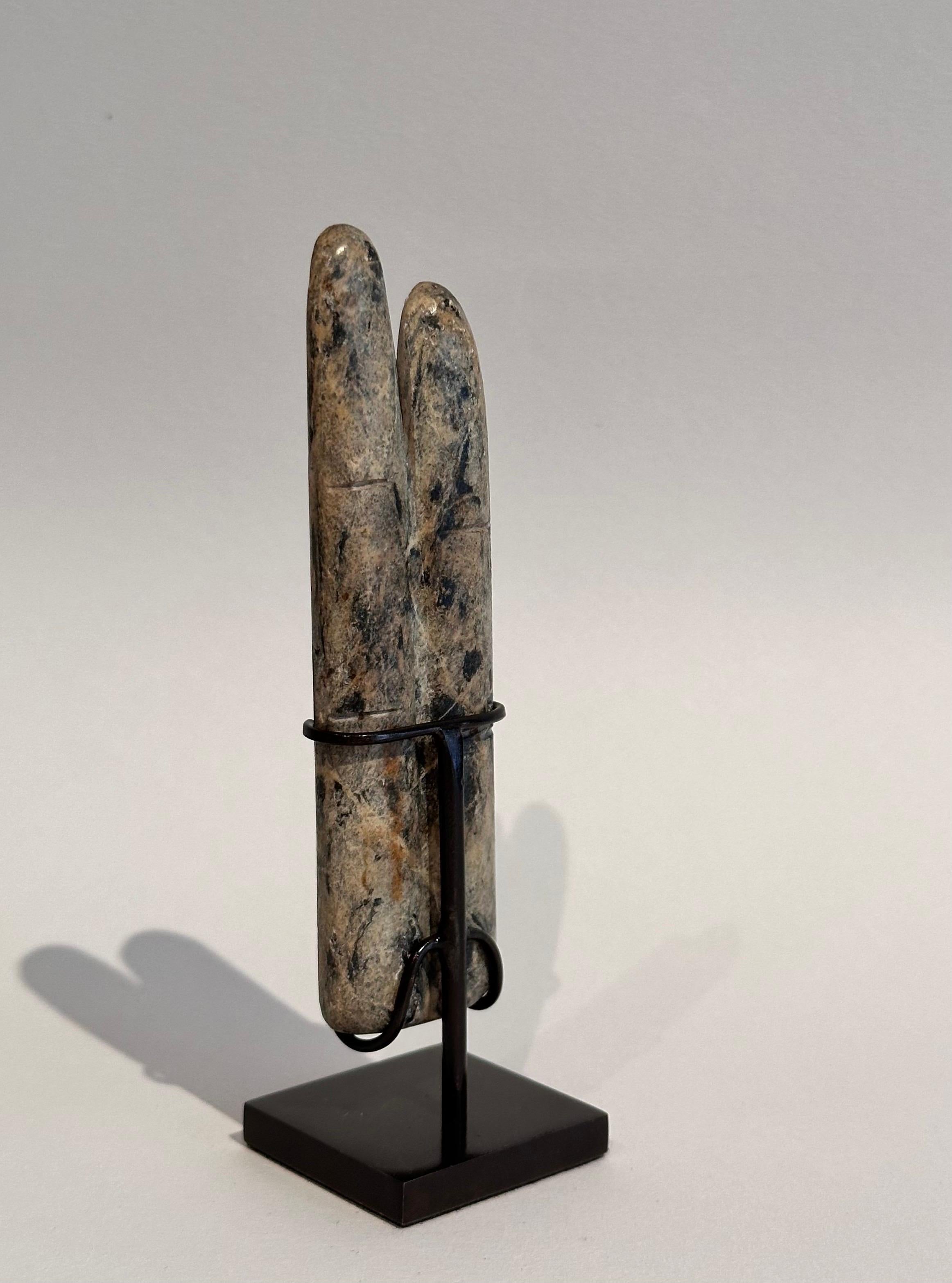 Egyptian green stone two fingers amulet.
Late period (664-332 before Christ).
Two stylized human fingers, index and medium, life-size.
Patinated bronze stand.

These amulets were used exclusively for the dead and were often found on the lower left