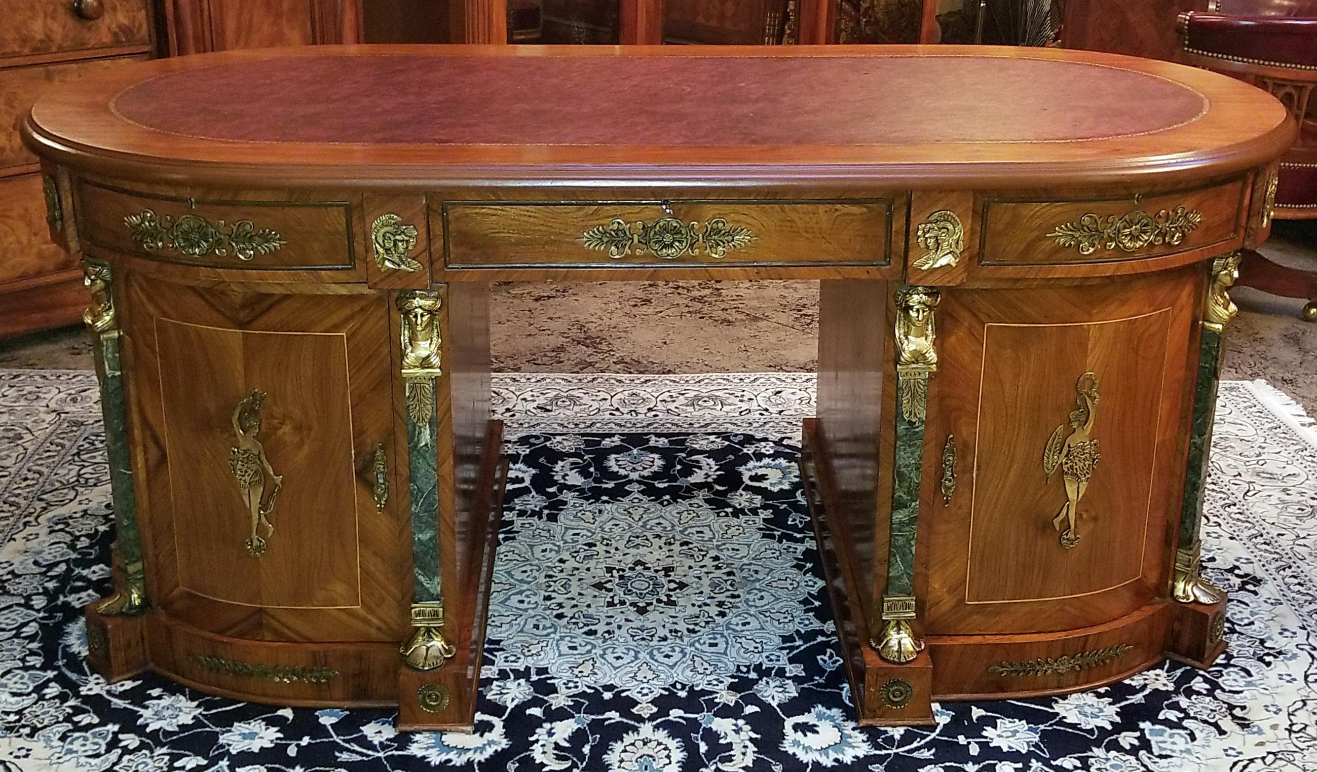Presenting a fabulous Egyptian Classical Revival desk from the mid-20th century.

From circa 1970.

This is what is known as an Egyptian made desk in the neoclassical revival style, complete with ormolu neoclassical figures and heads, marble