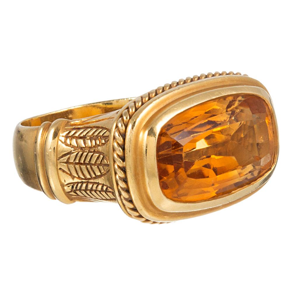 Striking and intricate details accent this substantial 18 karat yellow gold mounting and compliment the elongated cushion-shaped citrine at the center of the design. The piece bears Egyptian hallmarks inside the shank and boasts a sculpted setting