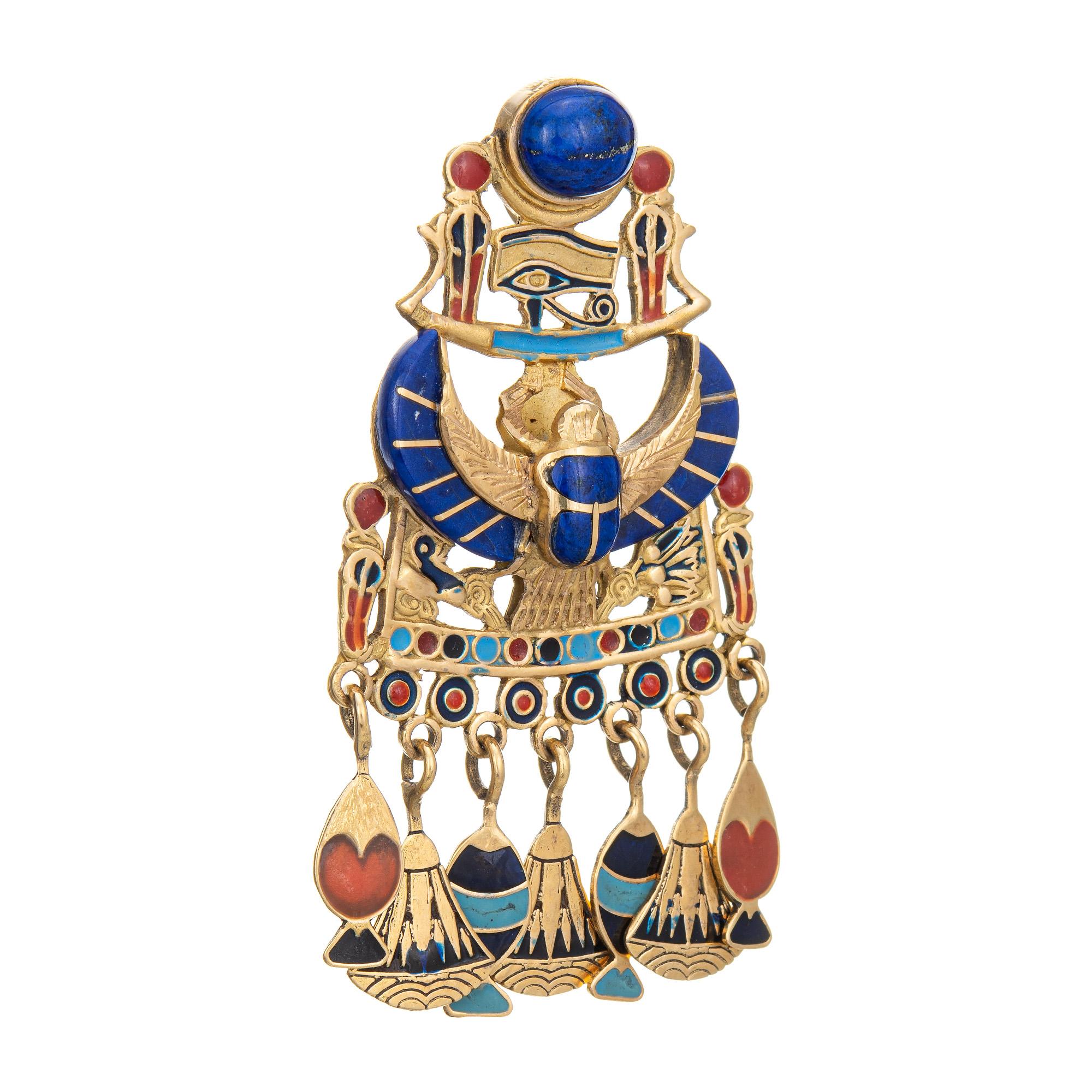 Finely detailed Egyptian pendant (circa 1960s to 1970s), crafted in 18 karat yellow gold. 

Lapis lazuli measures 9mm x 7mm (in very good condition and free or cracks or chips).

The elaborate pendant is beautifully detailed with various Egyptian