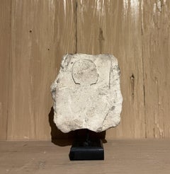Egyptian figurative limestone architectural fragment