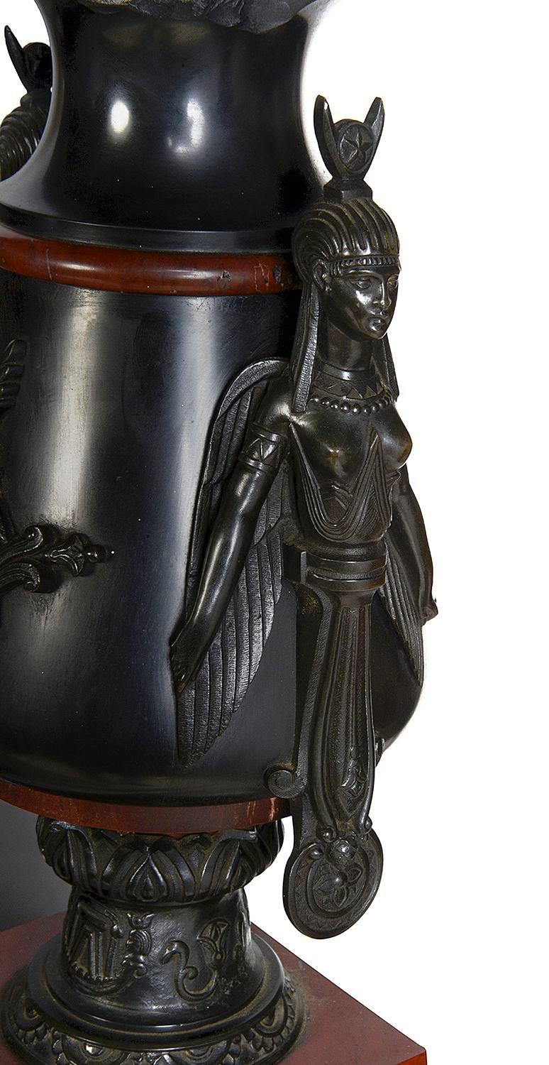 French Egyptian influenced clock garniture, 19th Century. For Sale