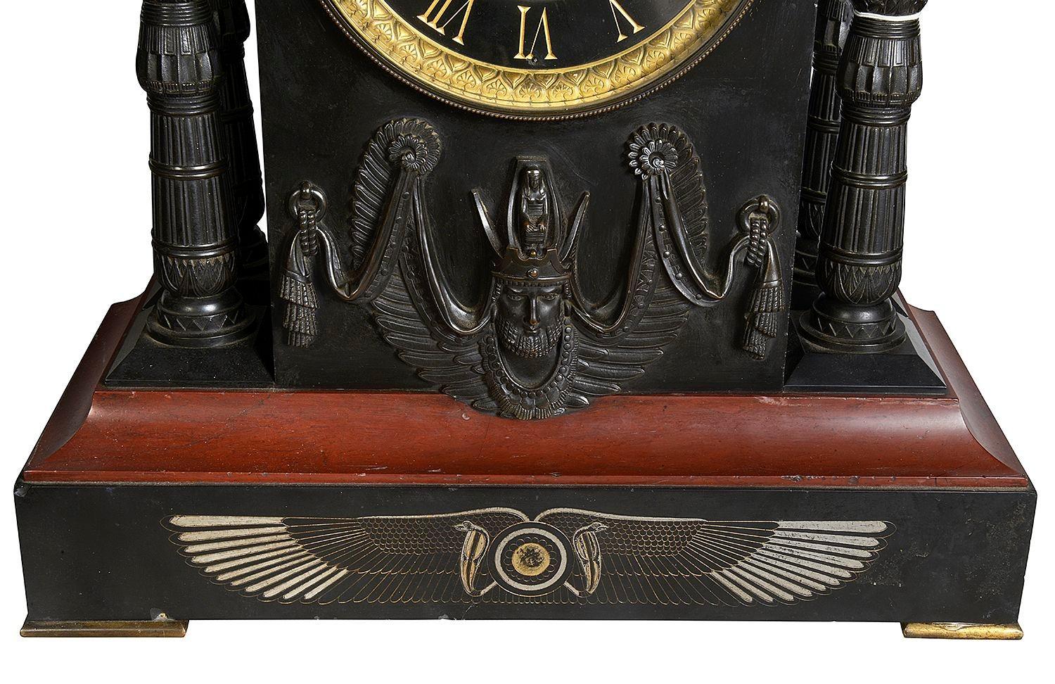 Bronze Egyptian influenced clock garniture, 19th Century. For Sale