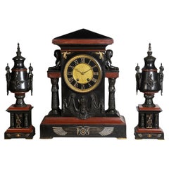 Used Egyptian influenced clock garniture, 19th Century.