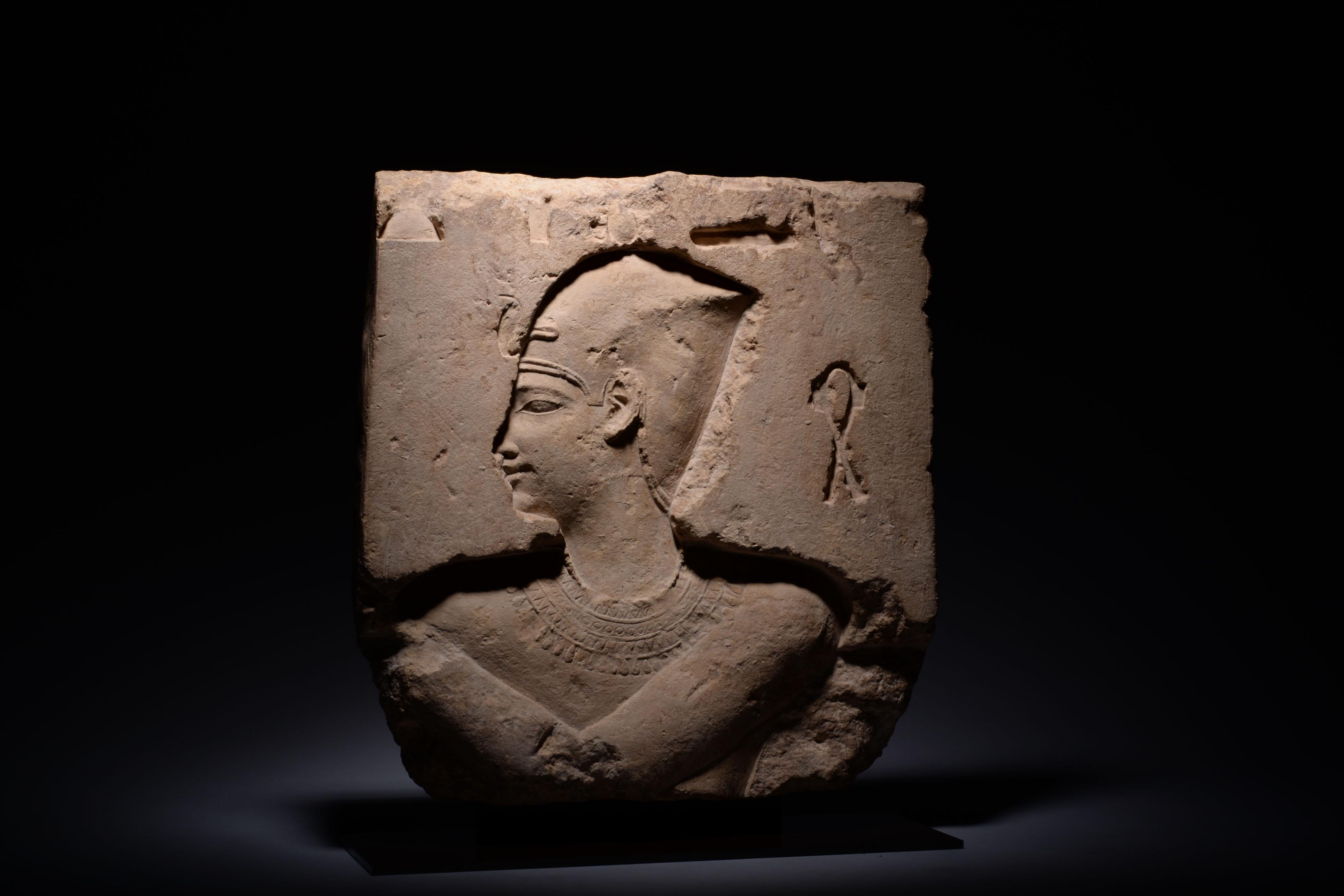 Deeply carved sunken relief with the profile of a king, likely Ptolemy II. He wears the Blue Crown, also known as the Khepresh or War Crown. The Sa symbol of protection is visible on his proper left. As a Macedonian Greeks ruling over a foreign