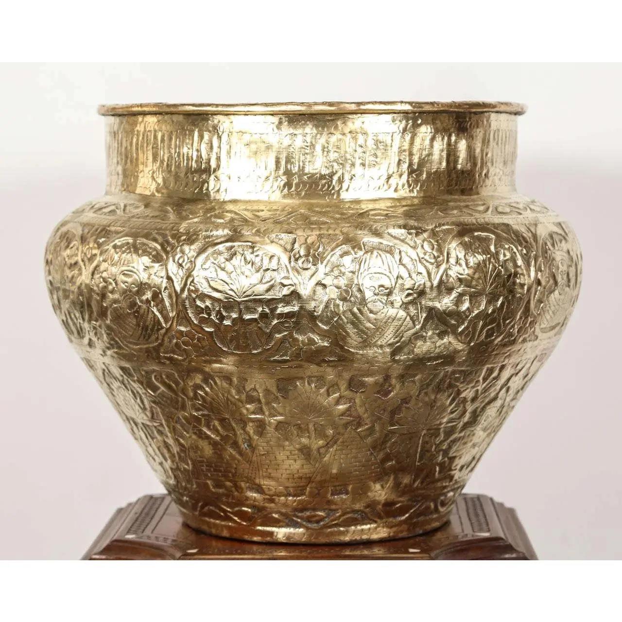 Egyptian hand-etched and repousse Mameluke style brass bowl.
Could be used as a jardinière, cache pot for a large orchids composition.
Engraved and hand-embossed with Arabic Islamic Thuluth writing calligraphy and geometric repousse with pyramid