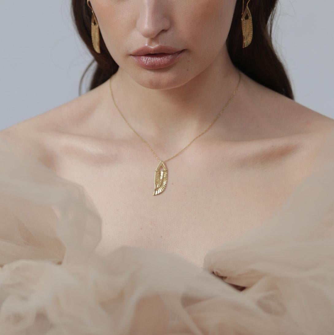 Inspired by the Goddess Isis who was worshiped in Ancient Egypt for being the ideal mother and wife alongside being the patroness of nature and magic. 

The necklace has a triangle art deco detail that has a hinge so the pendant can swing when