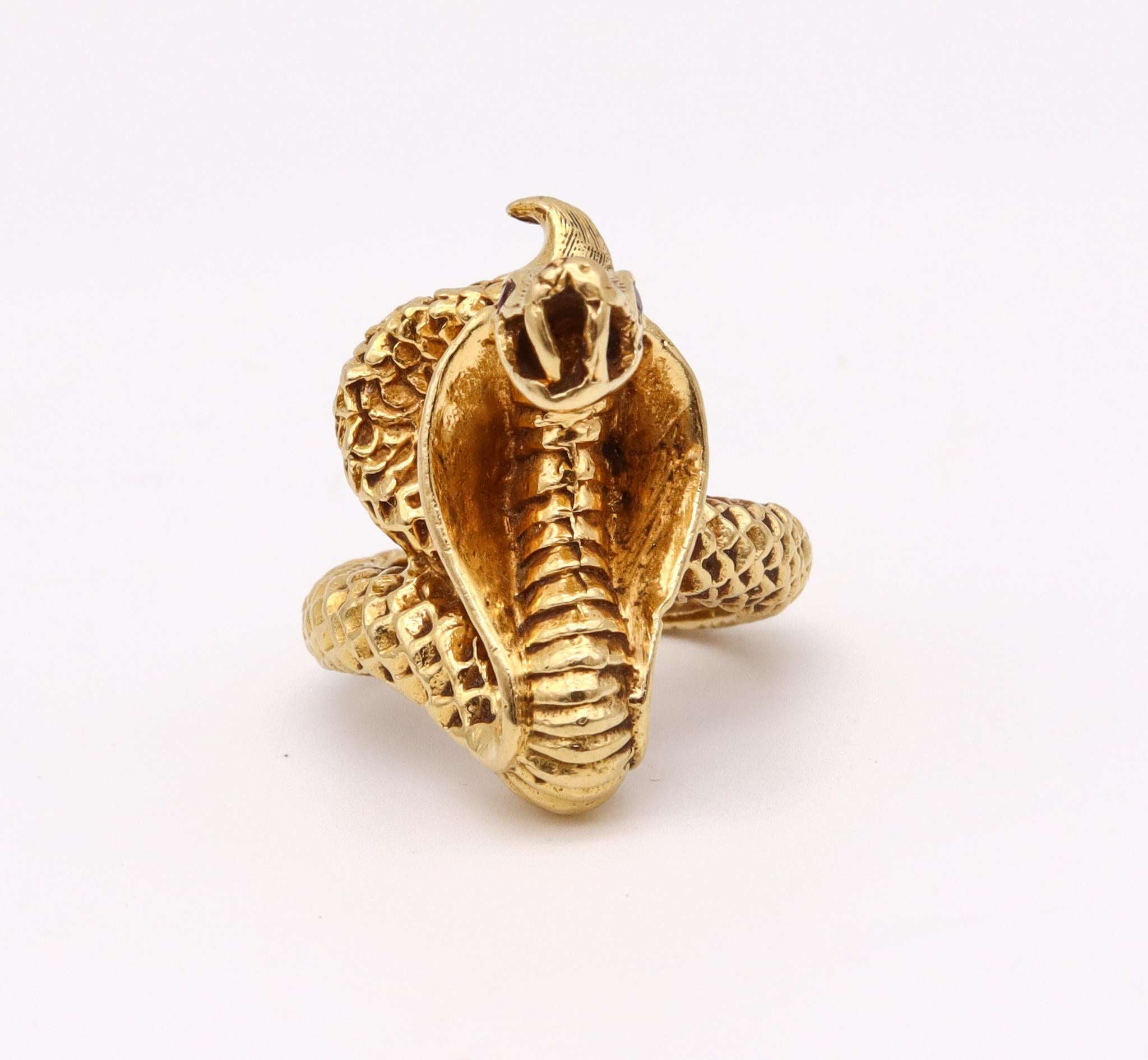 Art deco egyptian revival cobra ring.

Beautiful three dimensional ring, created during the art deco period with Egyptian revival patterns circa 1930's. This unusual cocktail ring has been sculpted in the form of a cobra in solid 18k yellow gold