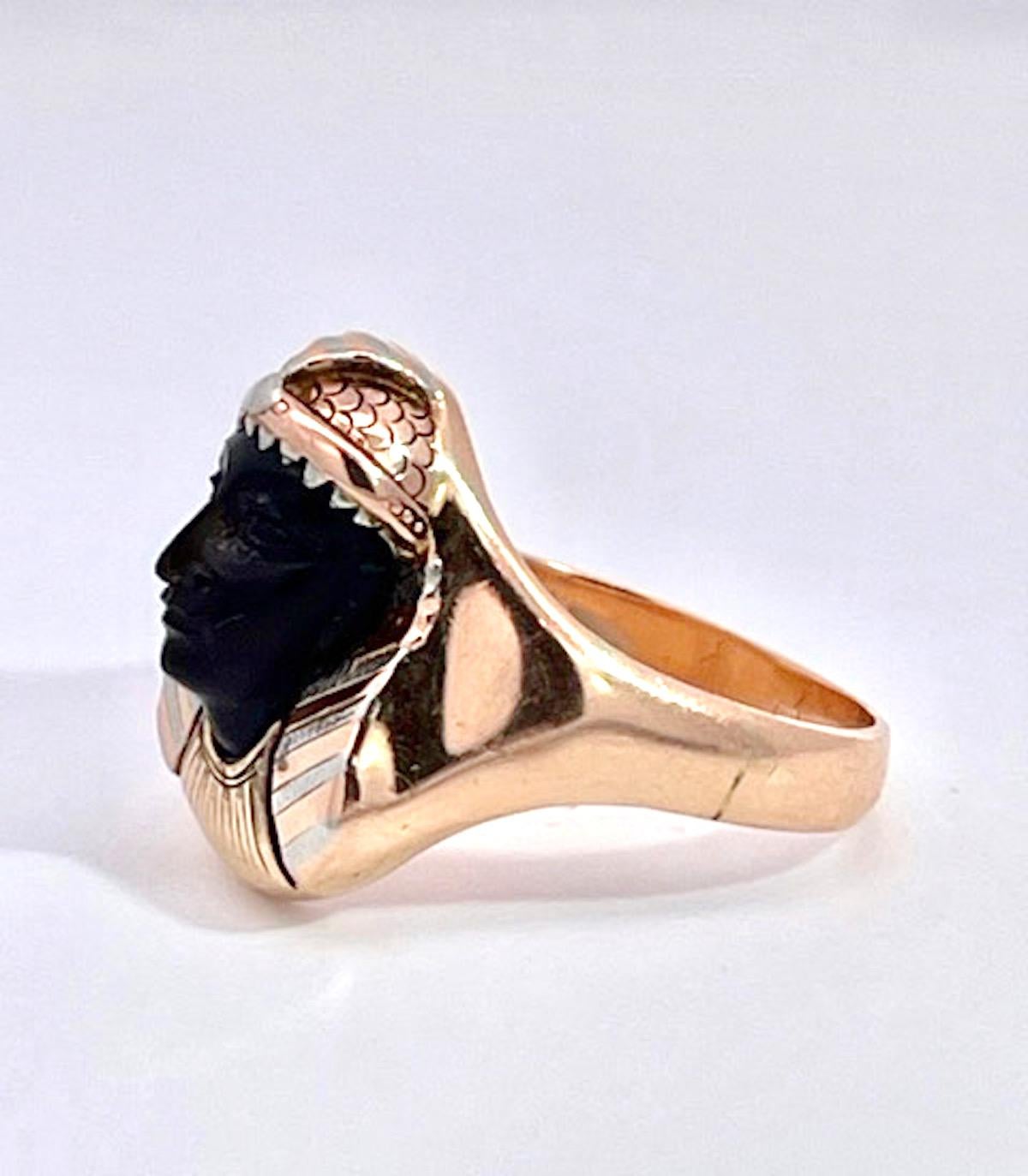 This Egyptian Revival Black Onyx Pharaoh Ring is set in tri-color gold with alot of detail.  The carved Onyx face is exquisite in perfect condition and gives this ring such a calming serene presence.  Once you put this ring on your finger you will