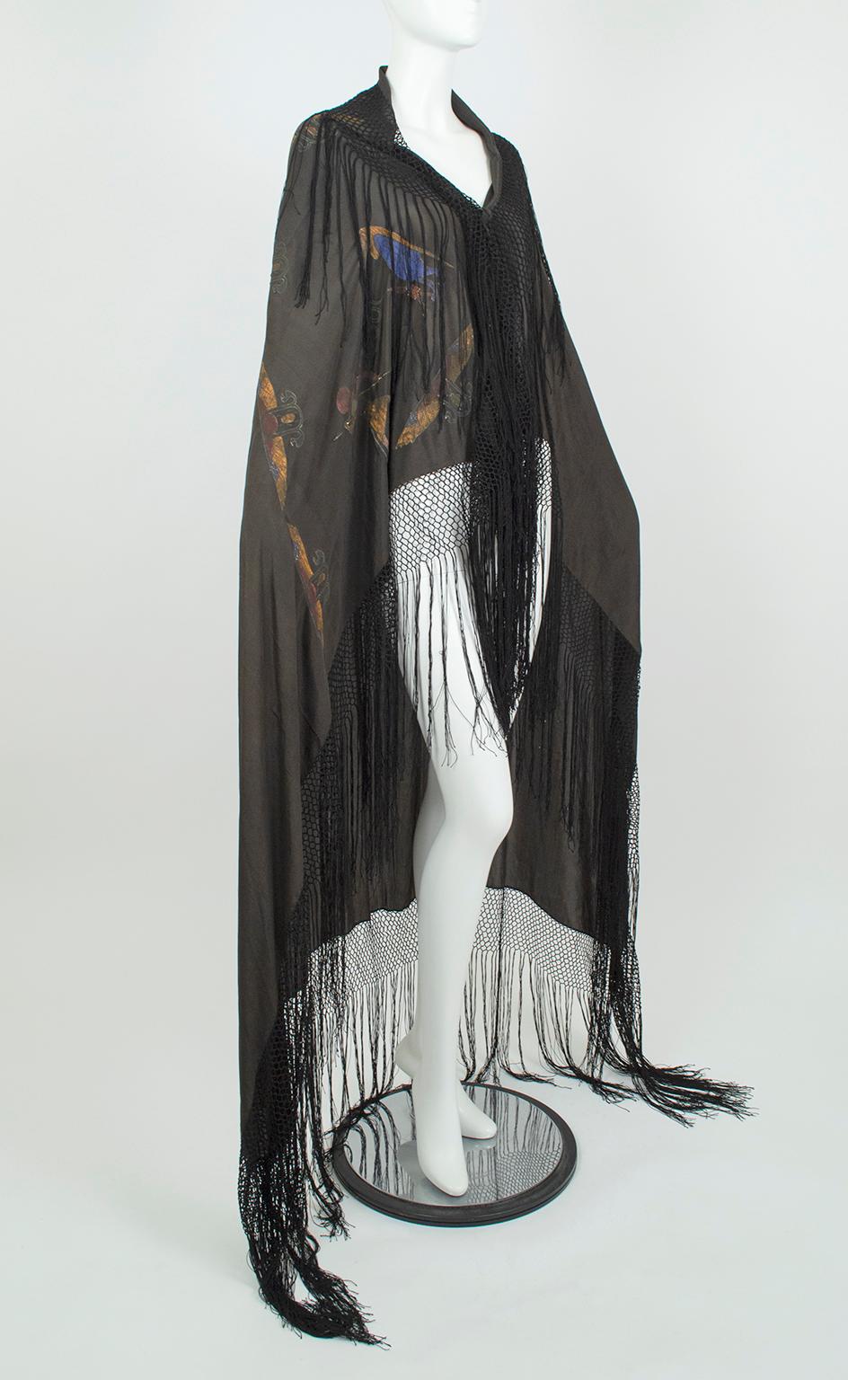 Whisper light despite its considerable size, this extraordinary shawl celebrates the global Egyptomania that merged Howard Carter’s discovery of Tutankhamen’s tomb in 1922 with Art Deco style. Simple yet striking, the shawl features a plain black