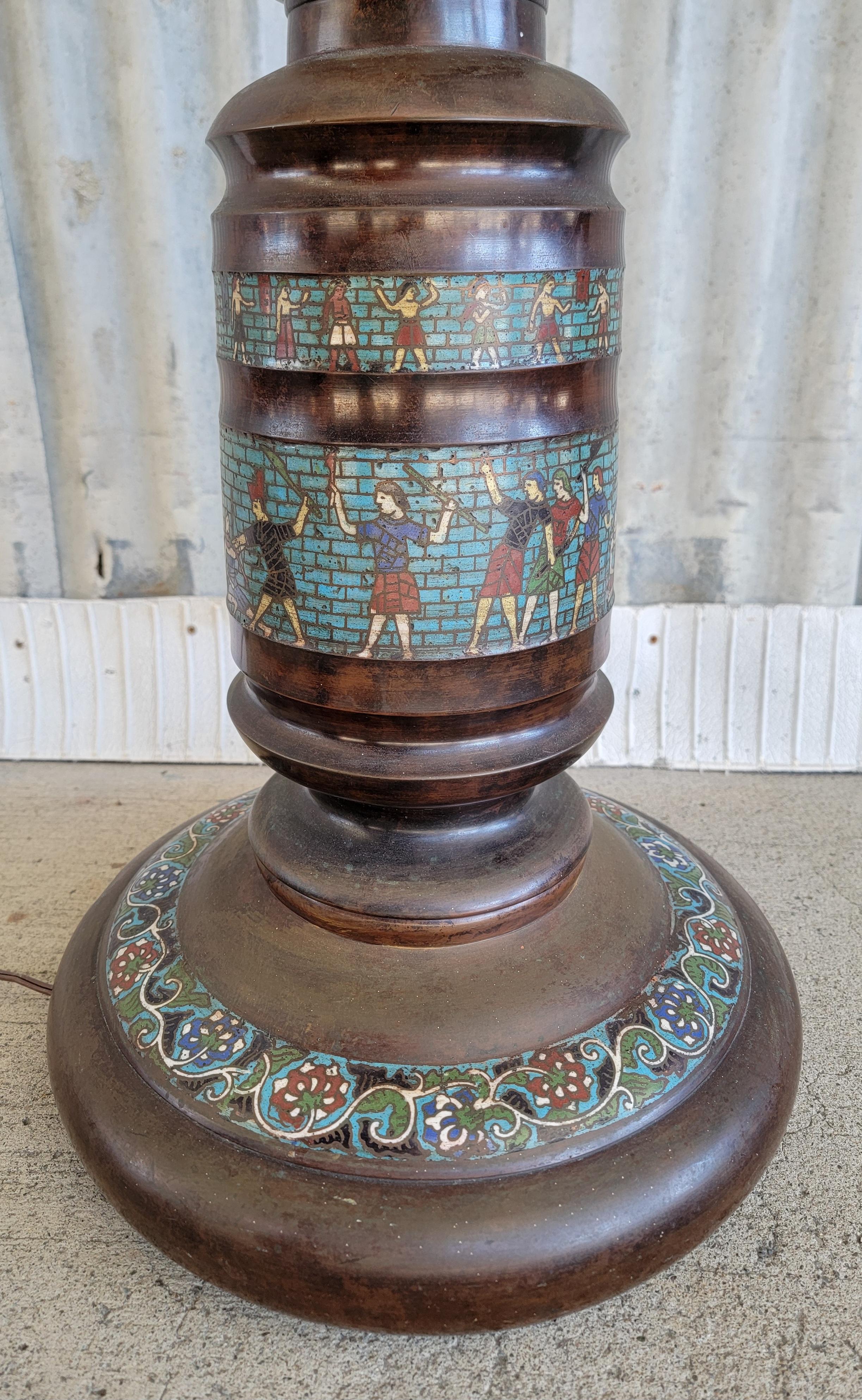 Unusual Egyptian Revival Japanese bronze floor lamp with cloisonne Egyptian figures. Measures 73 in to top of finial. Base measures 14 in diameter. Very good original condition with deep patina to bronze. Socket and shade harp have been replaced. In