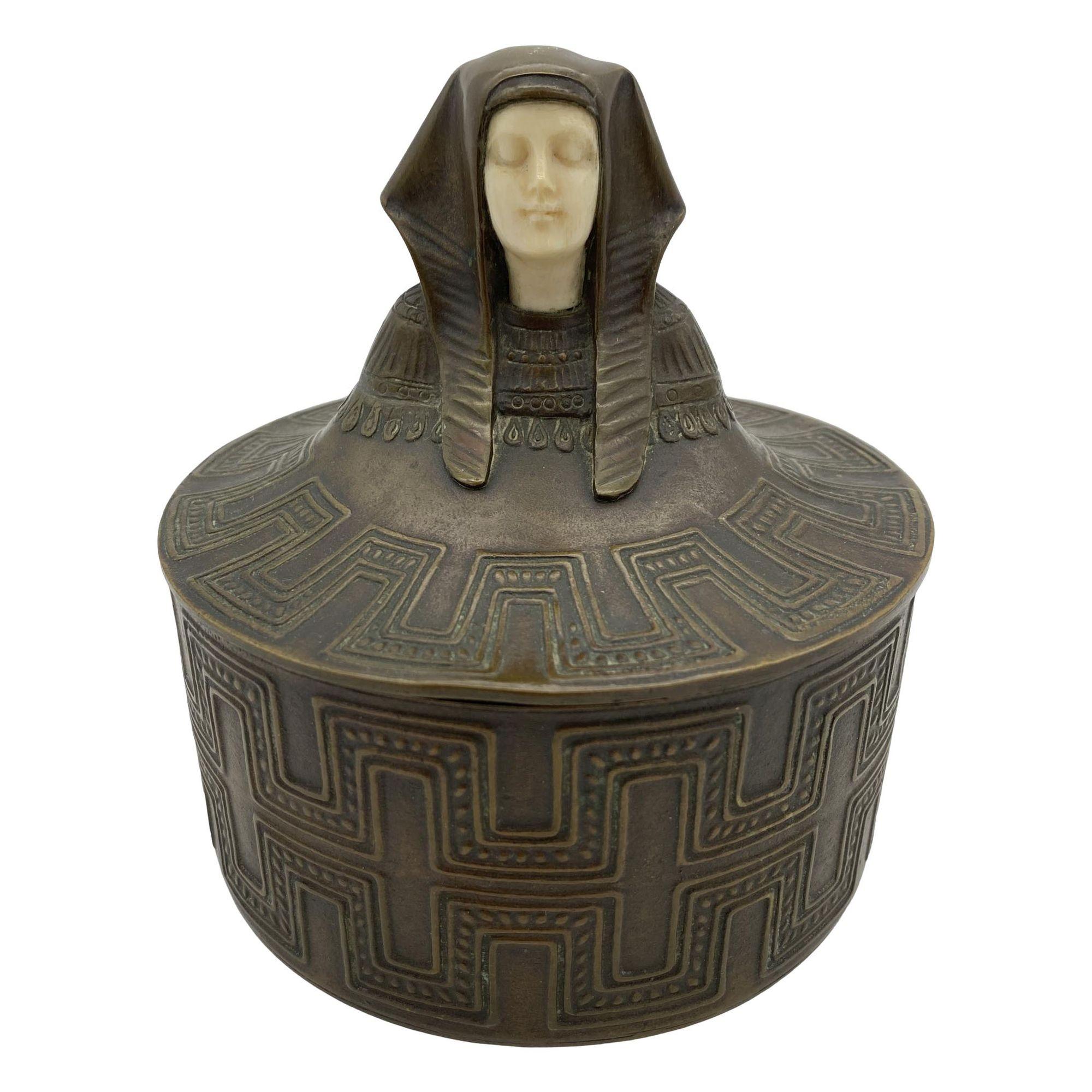 Art Deco Egyptian Revival Bronze Round Pharaoh Case W/ Carved Bone Face, Circa 1920 For Sale