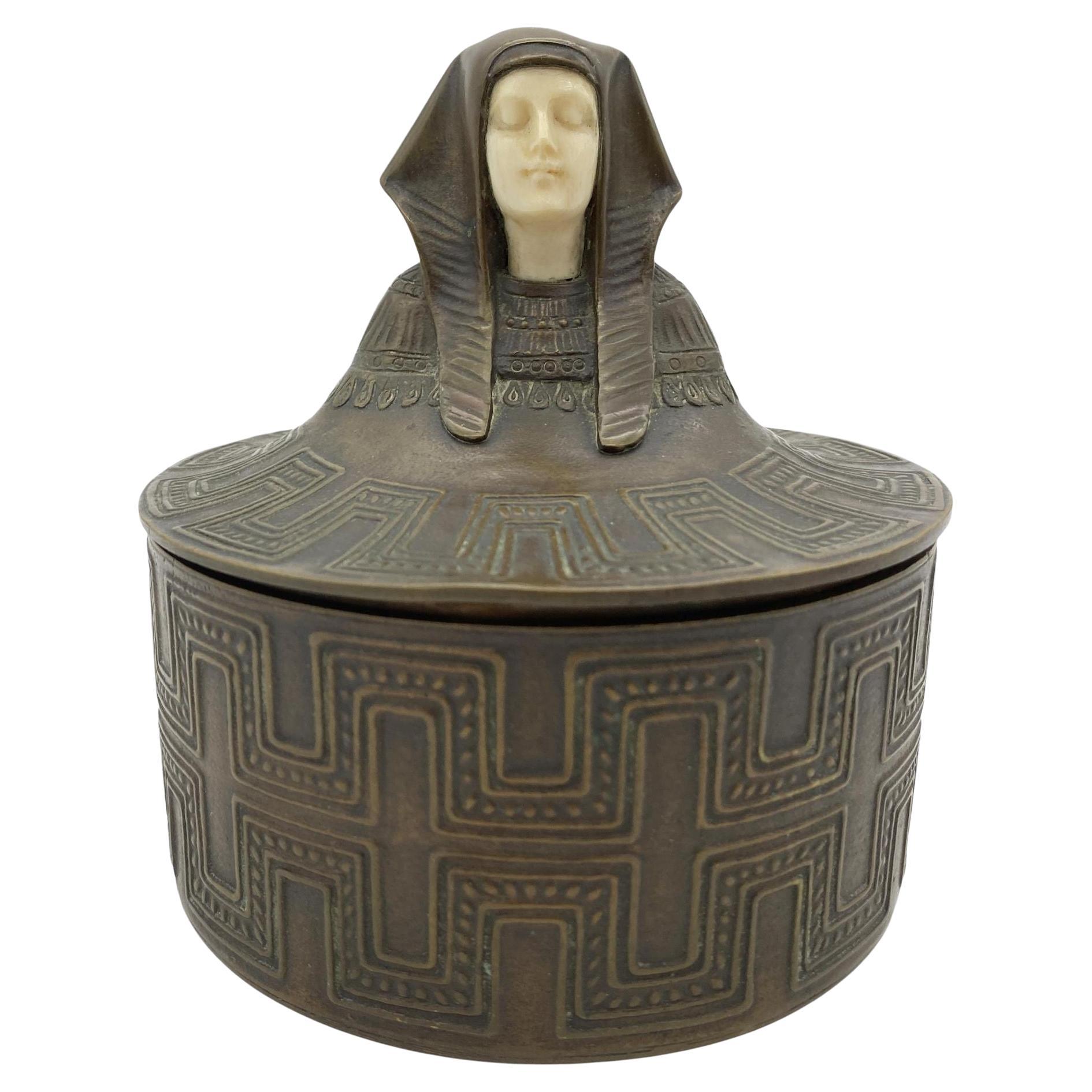 Egyptian Revival Bronze Round Pharaoh Case W/ Carved Bone Face, Circa 1920 For Sale