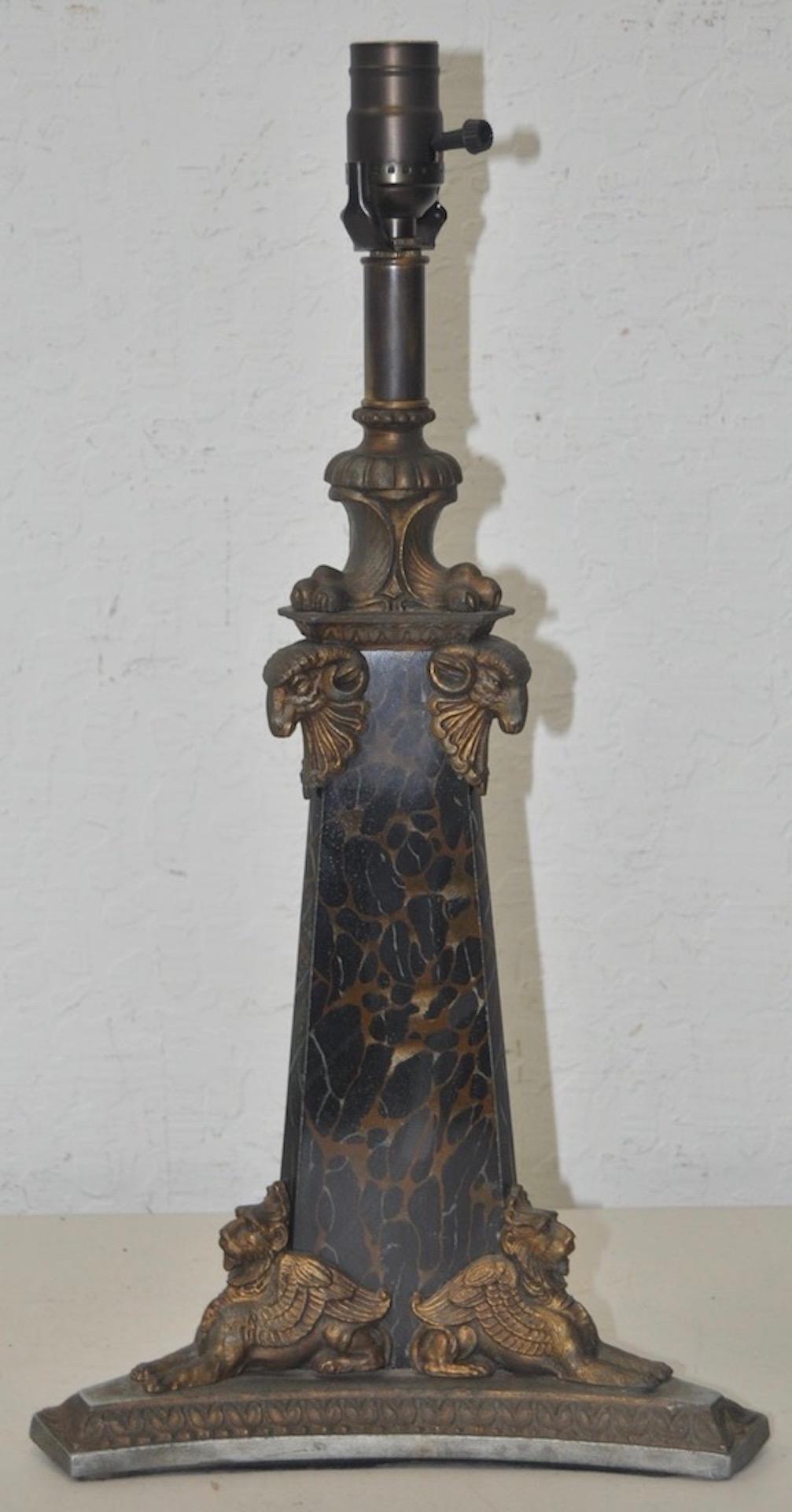 Egyptian revival cast iron faux marble table lamp, circa 1900

Pyramid shaped cast iron table lamp with a hand painted faux marble body and brass ormolu mounts.

The top mounts show one of the earliest Egyptian gods 