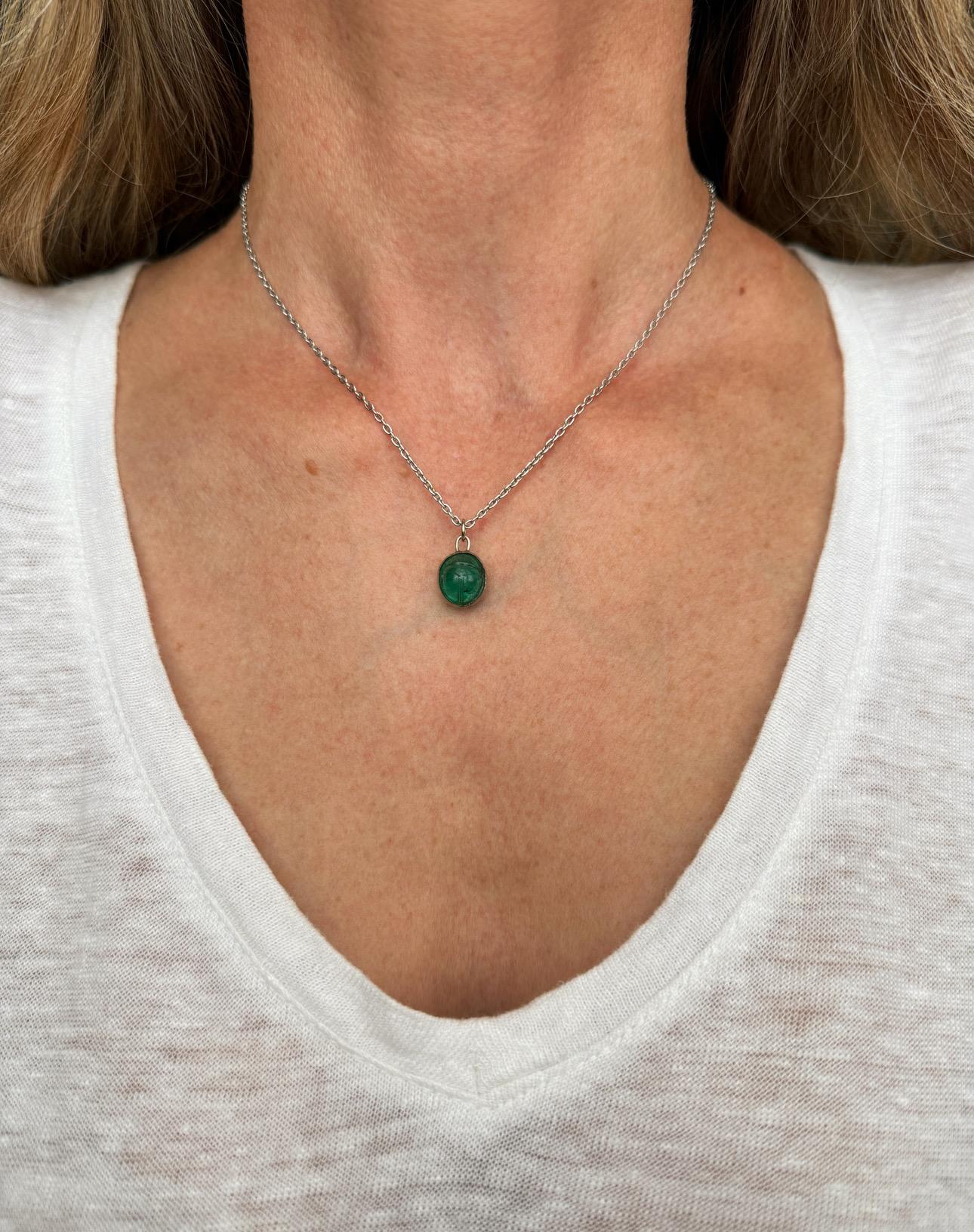 Egyptian revival jewelry became wildly popular during the Art Deco period after King Tut’s tomb was discovered in 1922. This one of a kind Art Deco scarab is crafted from a vibrant green Colombian emerald, wrapped in a thin band of platinum and