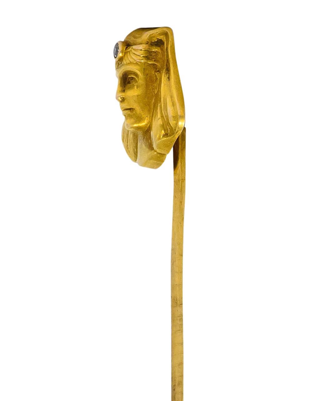 Repoussé gold depicting the head of a pharaoh with headdress 

Headdress centering a single cut diamond weighing approximately 0.02 carat, eye-clean and white

Lovingly detailed gold with a regal expression

Head Measures: Approx. 1/2 x 1/2