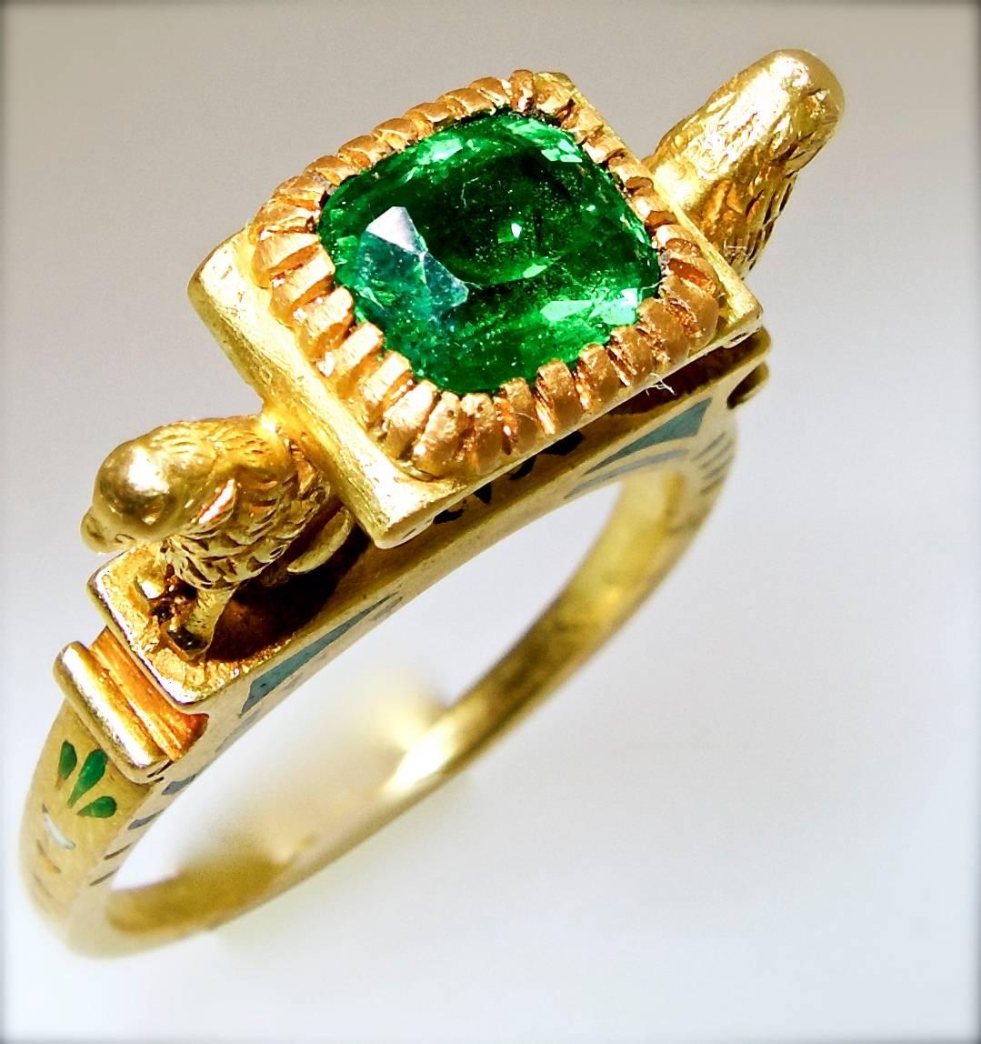 This sublime 18K yellow gold ring was made in Paris, circa 1923.  The multi-color enamel is quite fine and the gold work of the entire ring - especially the two lions 