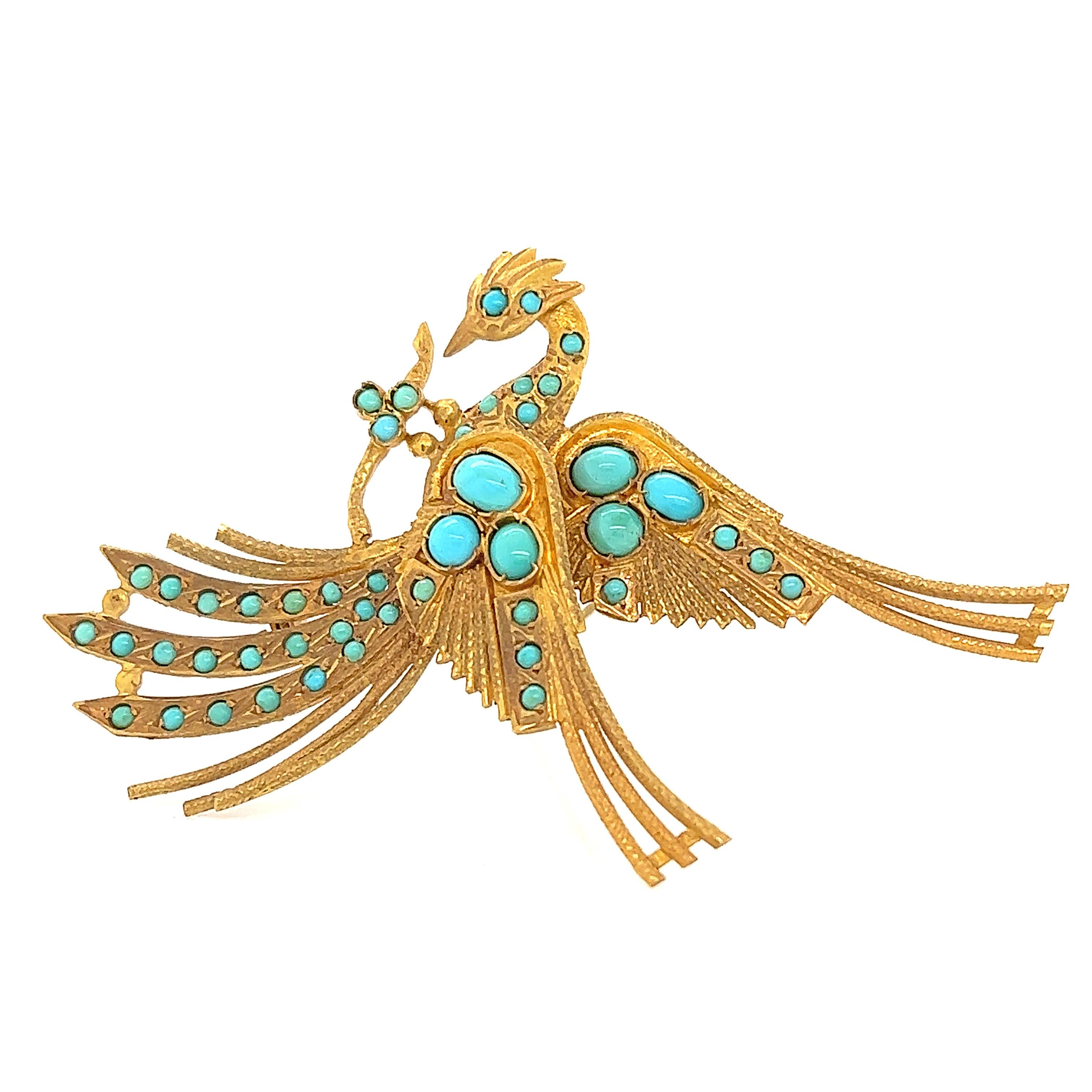 Beautiful design seen on this hand made Egyptian revival brooch. The brooch is crafted in 18k yellow gold and in the theme of a Phoenix, a mythical bird. The gold workings on the brooch is truly phenomenal, techniques that were rarely seen and far