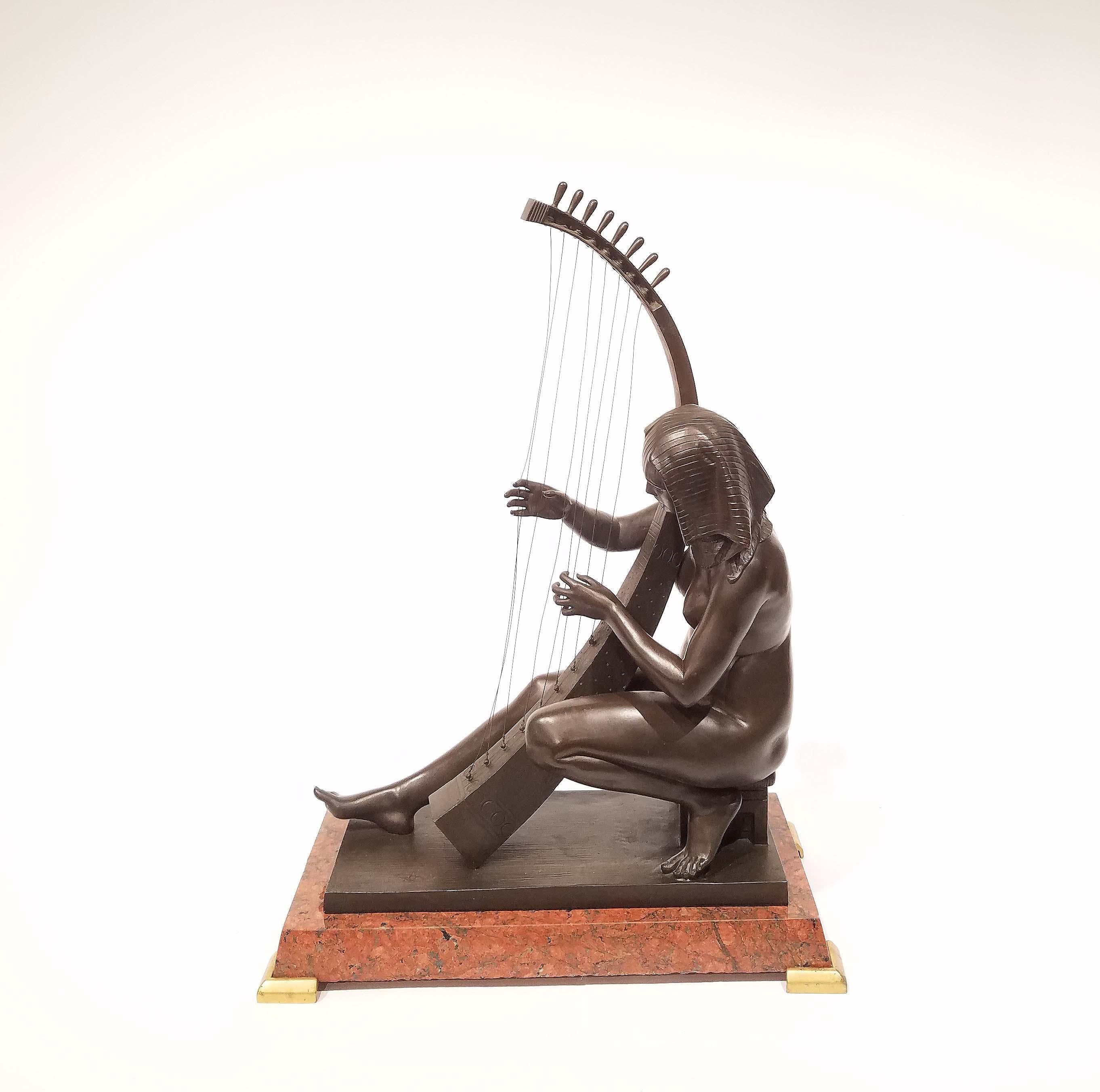 Egyptian Revival Grand Tour bronze of maiden playing a harp. Patinated bronze in rich brown/black on a granite base. Wonderful details. Measures: Over all 20