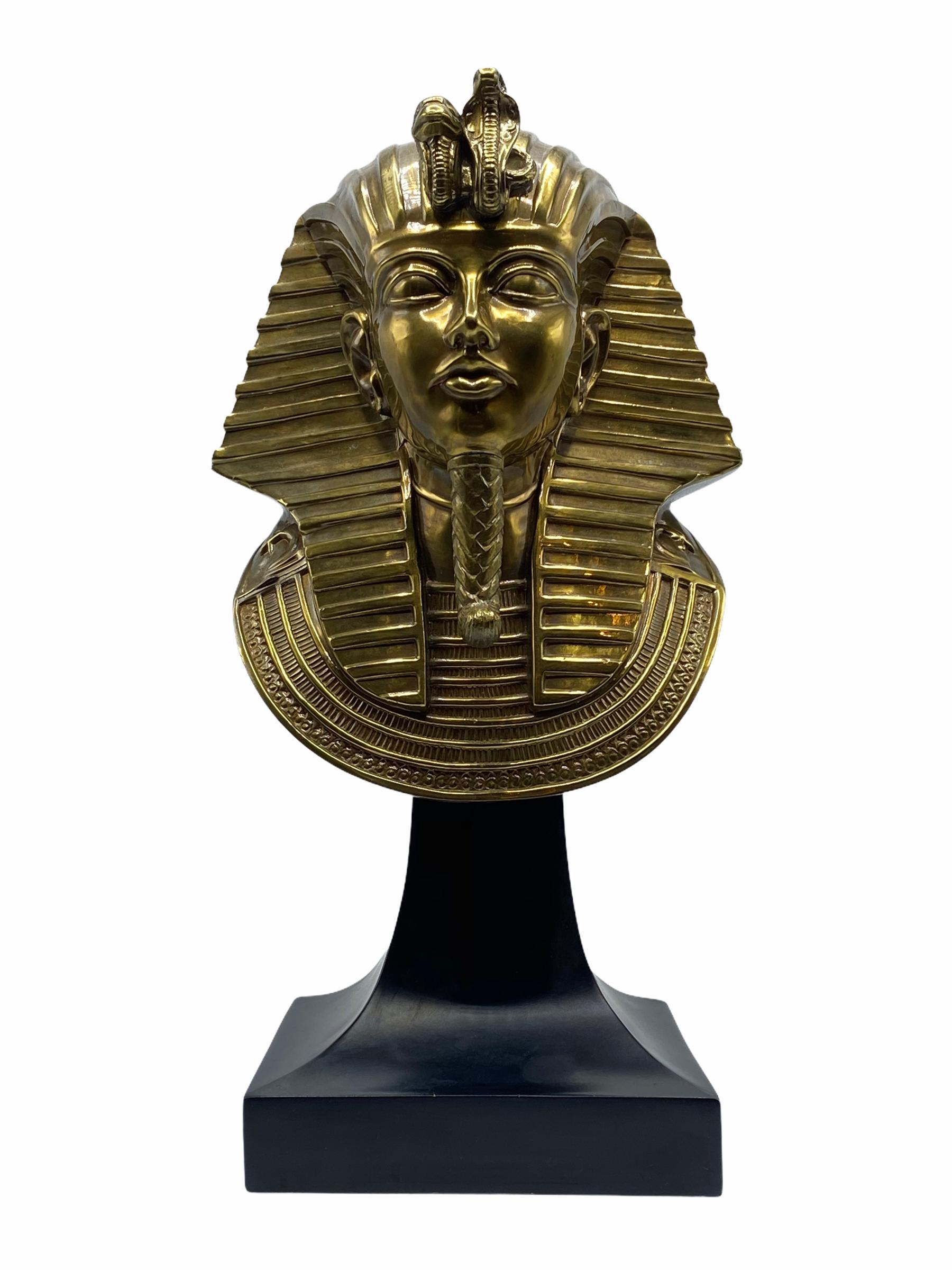 Egyptian Revival King Tut bronze bust sculpture on a black painted composition base.
Very nice casting.